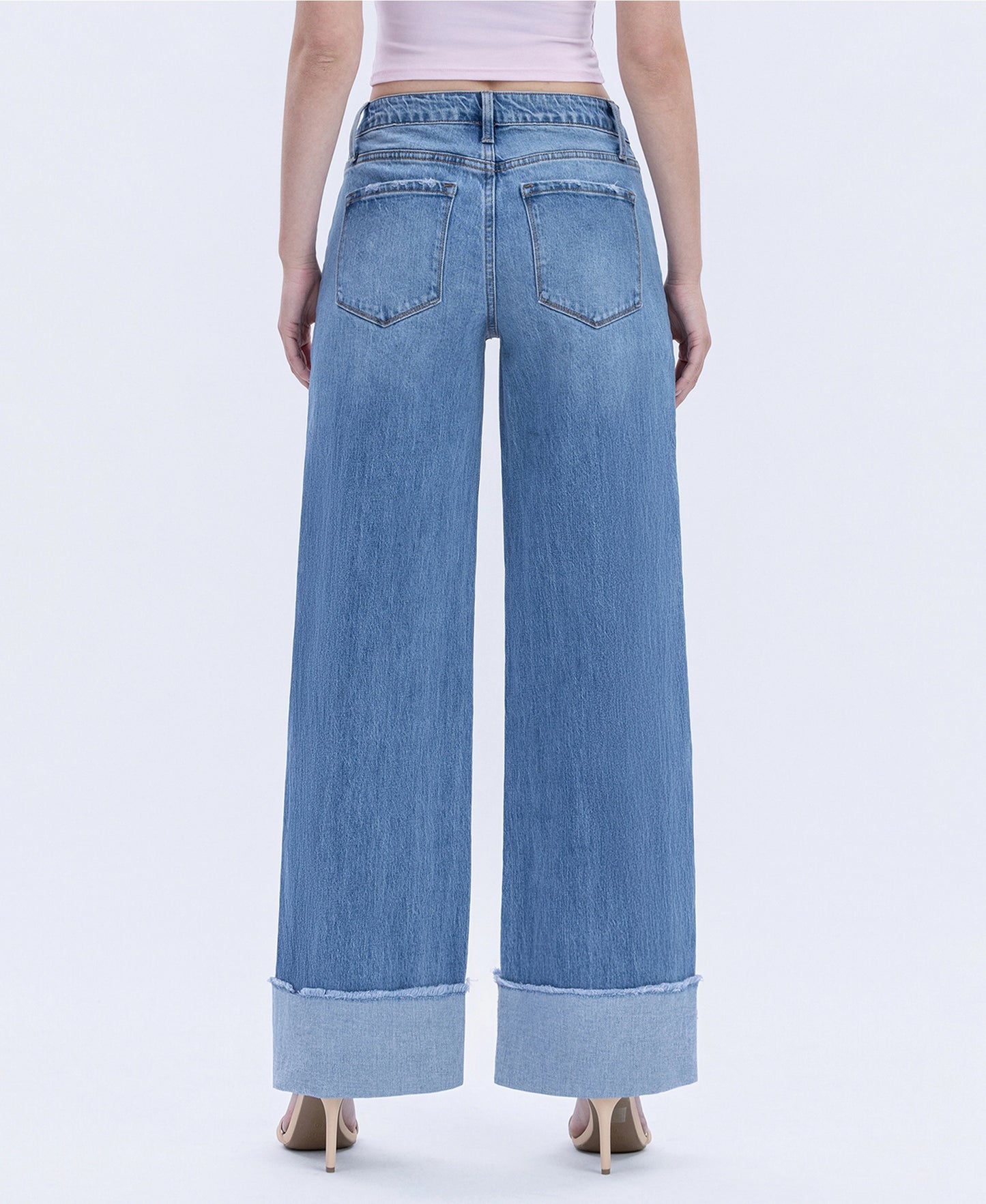 Vervet Downtown Darling denim jeans shown on a model, featuring classic five-pocket style and a slim fit in medium wash.