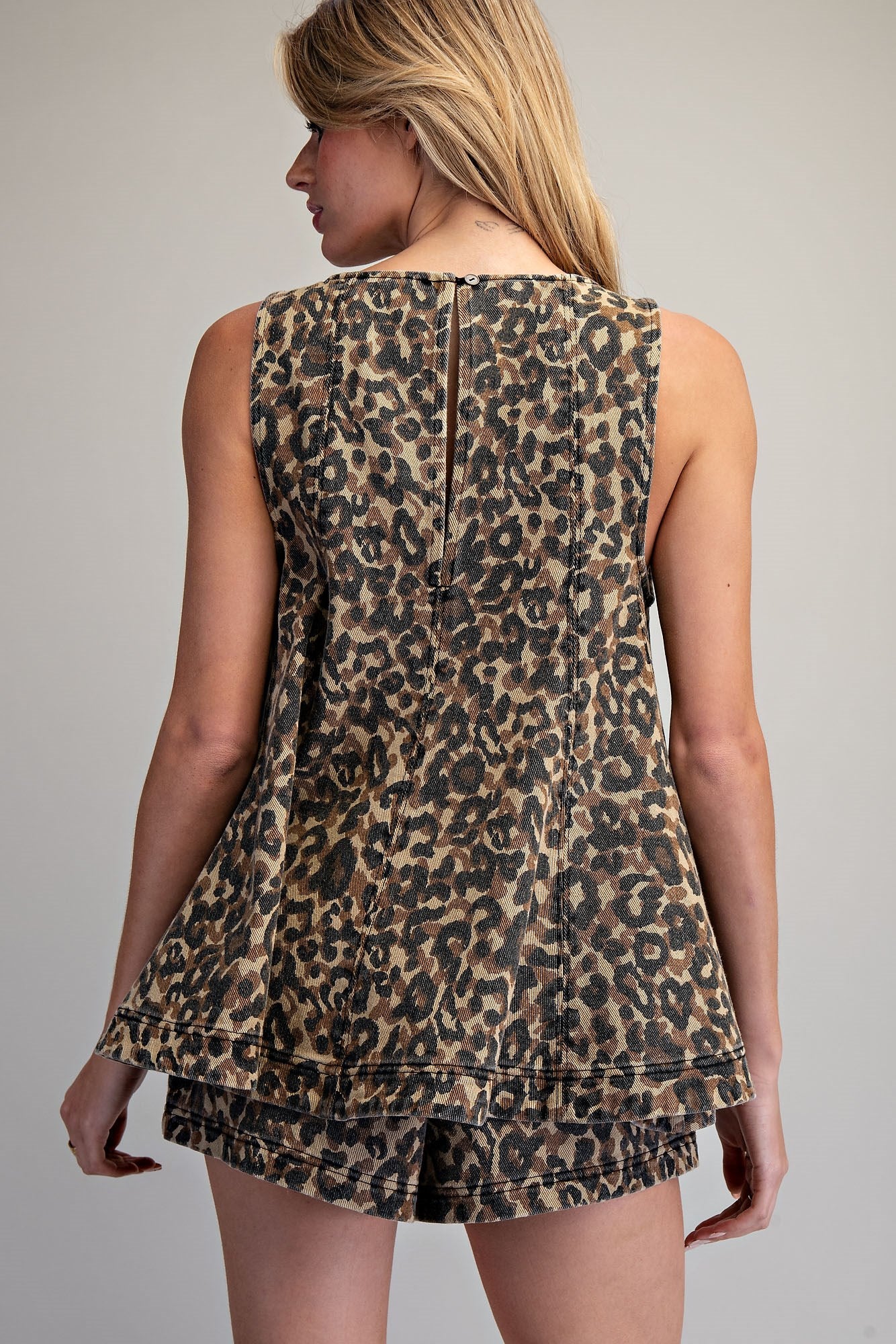 Ee:some Fierce & Free Top featuring a stylish design, displayed on a mannequin with a vibrant pattern and modern fit.