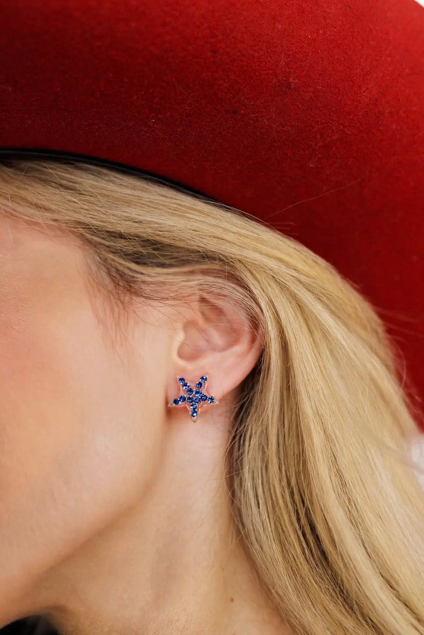Patriotic stud earrings by Brianna Cannon featuring red, white, and blue star designs on silver posts.