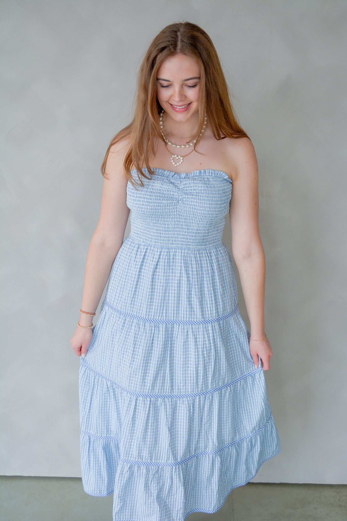 Baby Pink Soft Statement Midi Dress in baby blue, featuring a flowy silhouette and stylish design, shown on a model.