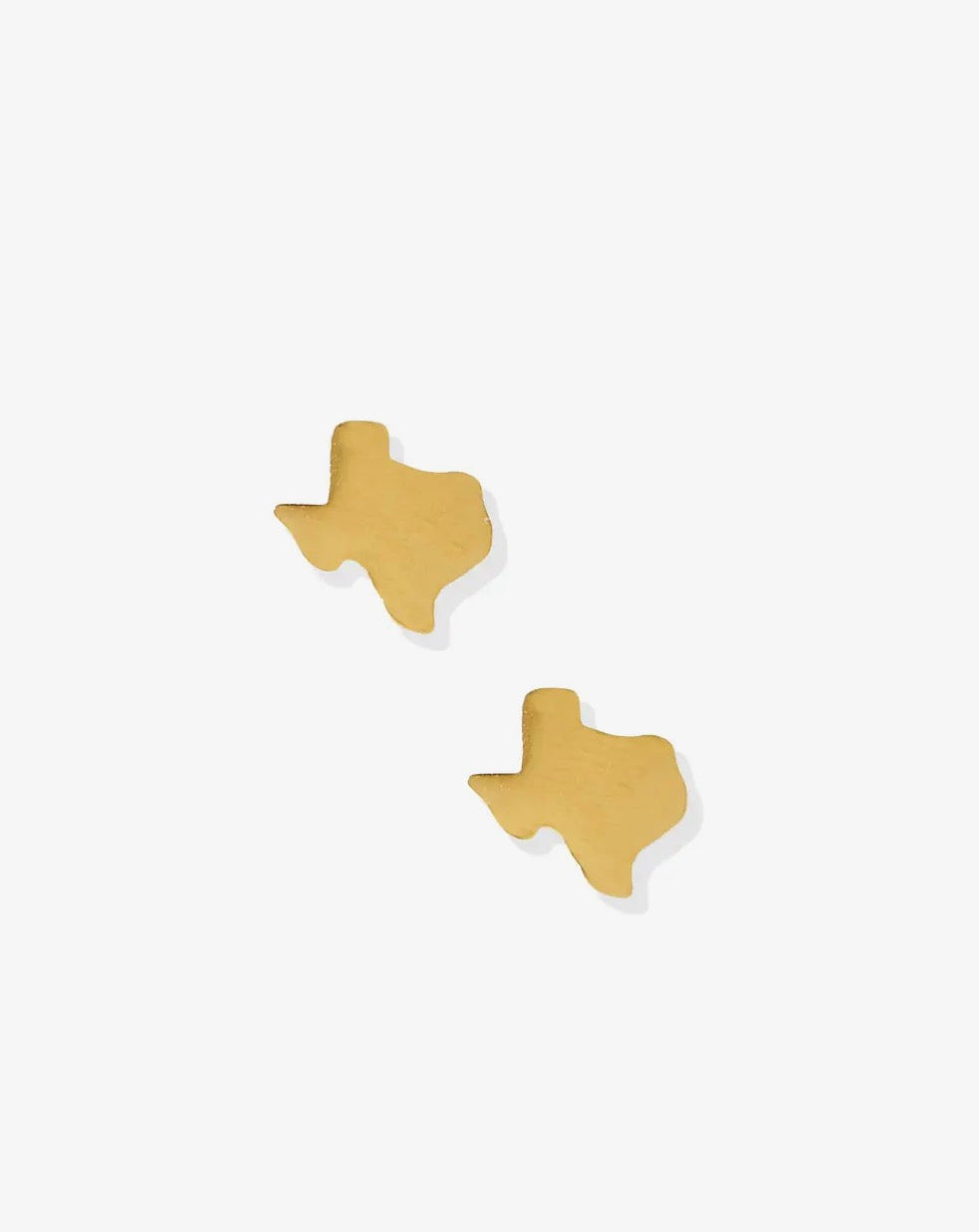Gold screwback earrings featuring Big Texas design by Linny CO, shown in a close-up view of the detailed jewelry.