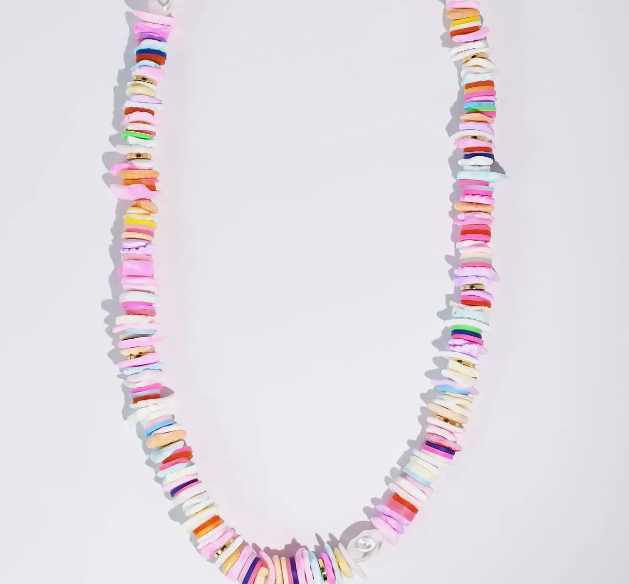 Pastel gemstone necklace by Treasure Jewels featuring colorful, faceted gemstones arranged in a stylish jewelry design.