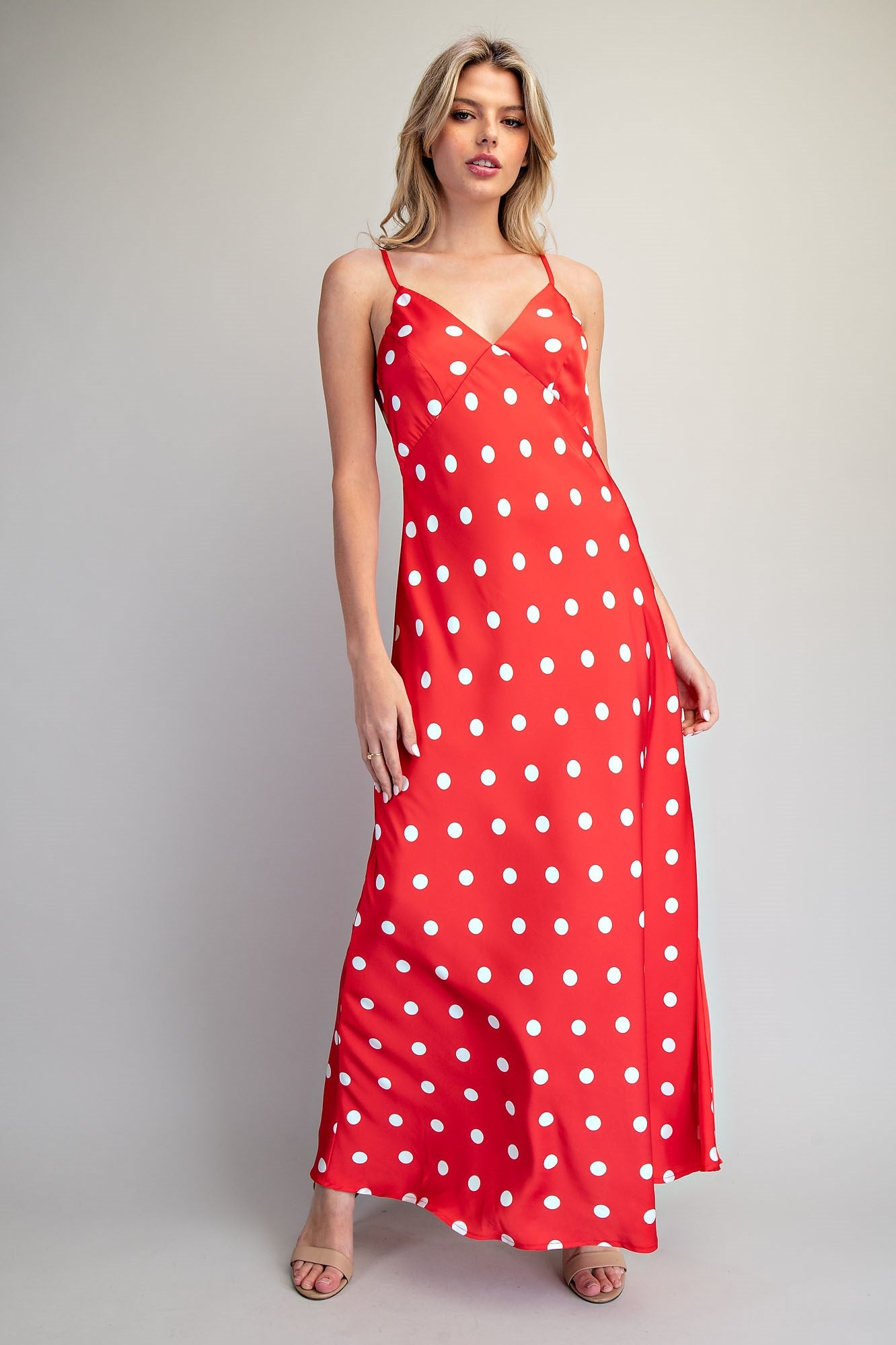Eesome Dottie Delight Dress featuring a floral pattern, sleeveless design, and lightweight fabric on a model.