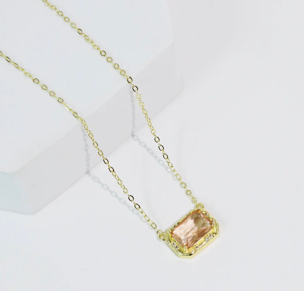 Treasure Jewels pretty gem necklace featuring colorful gemstones on a delicate chain, close-up view of the jewelry.