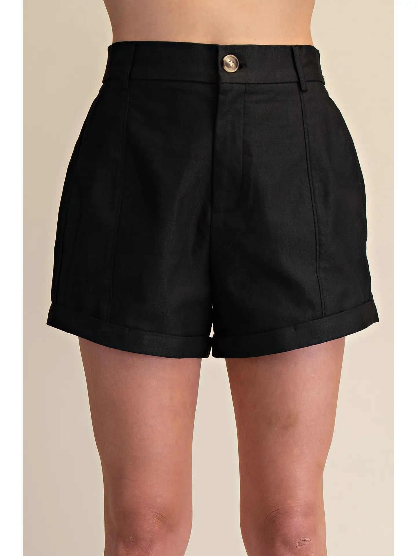GLAM Midnight Ease denim shorts with frayed hem and distressed details, styled on a model with casual urban background.