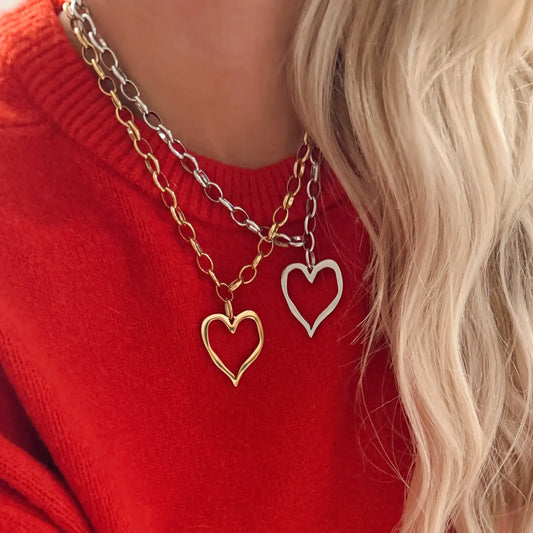 Large open heart necklace by ChansuttPearls featuring a silver chain and a delicate open heart pendant.