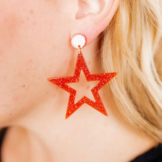 Linny Co Glory Earrings featuring elegant gold-tone hoops with intricate detailing and sparkling accents.