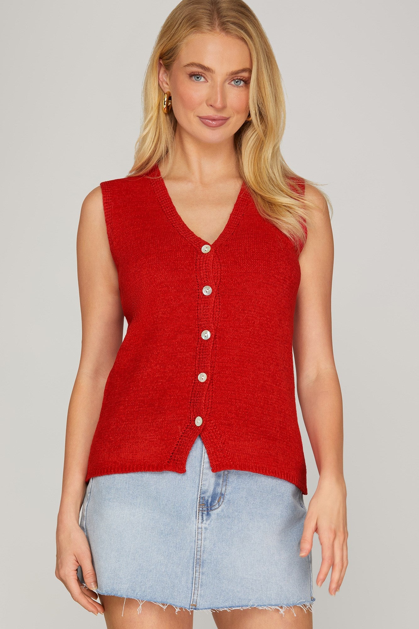 She+Sky red sweater vest from The It Girl collection, featuring a cozy knit fabric and classic fit on a mannequin.