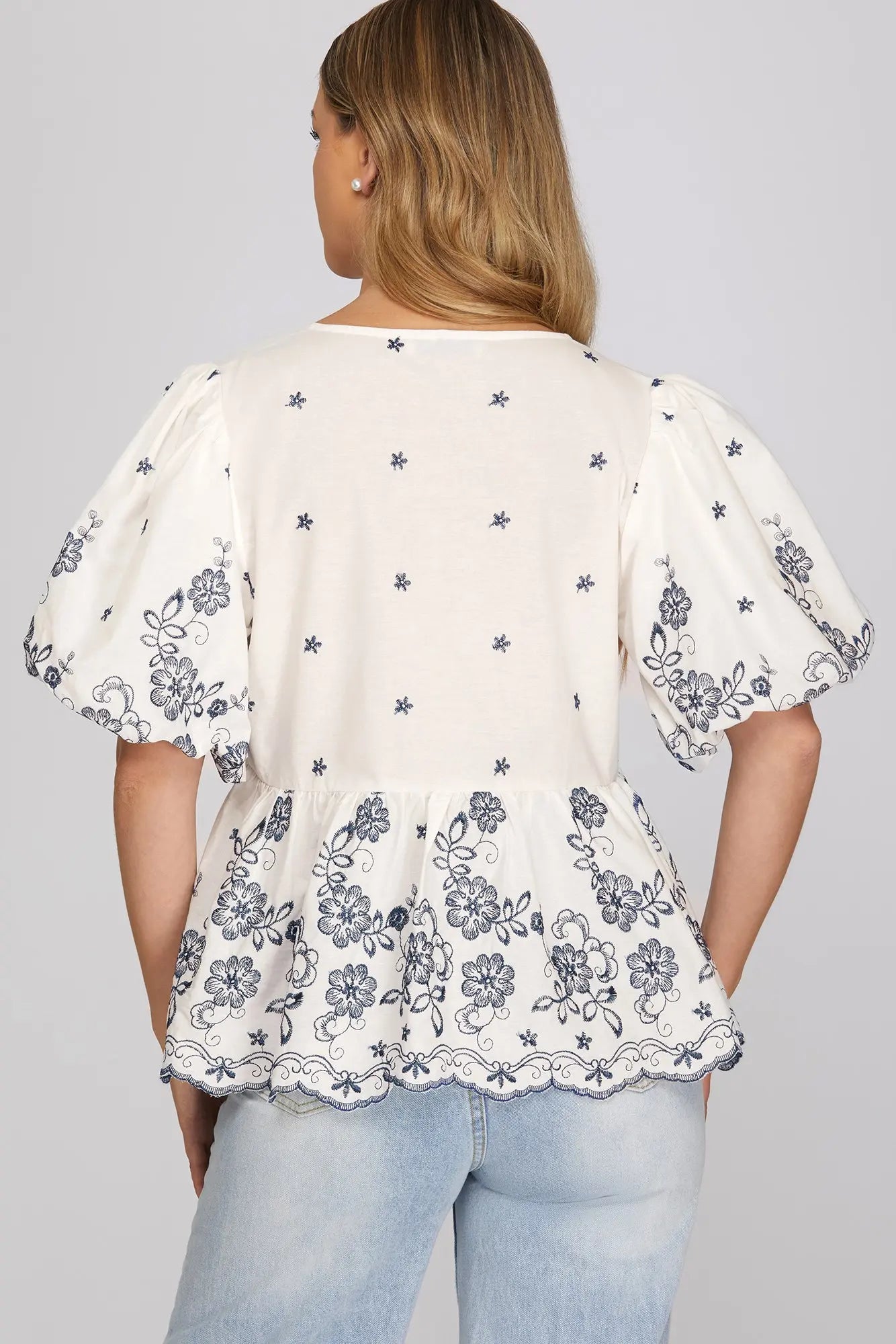 She+Sky Midnight Floral Blouse featuring a dark background with vibrant floral print and long sleeves.