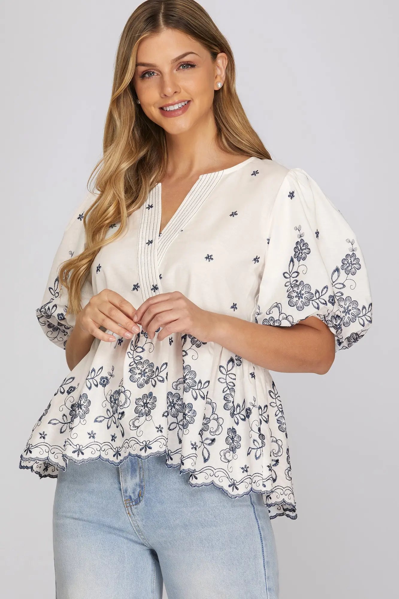 She+Sky Midnight Floral Blouse featuring a dark background with vibrant floral patterns and a relaxed fit.