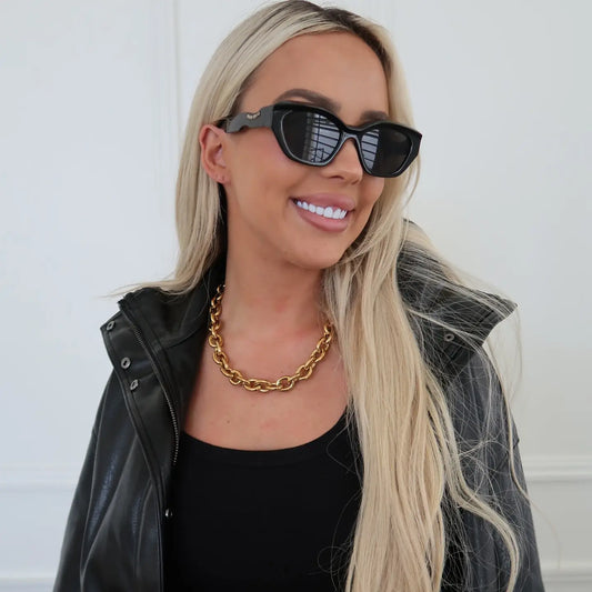 Liv Necklace by Chansuttpearls featuring elegant pearl strands and delicate clasp on a neutral background.