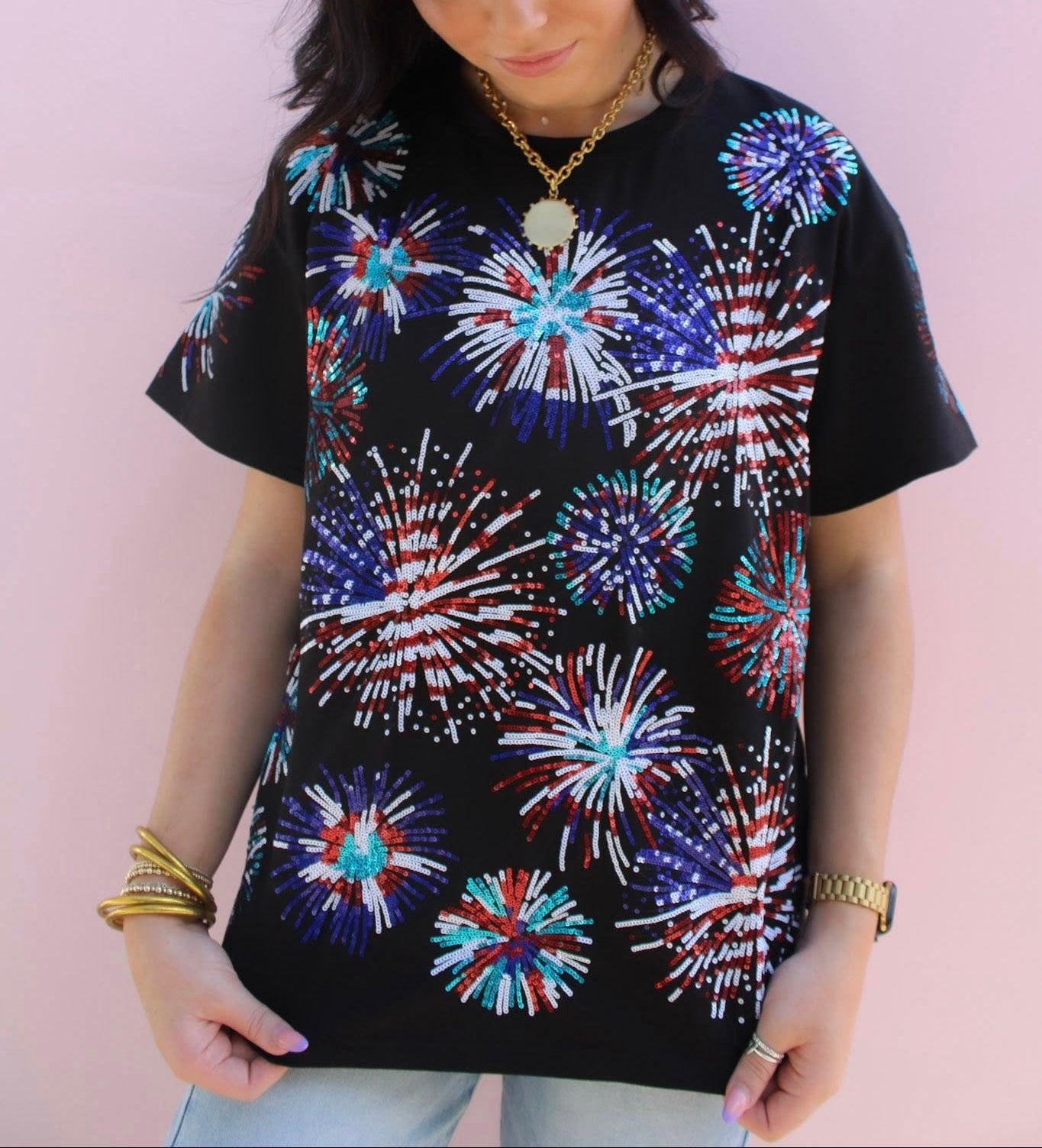 RJM Glitz Midnight Firecracker T-shirt featuring a dark background and vibrant firecracker graphic design.
