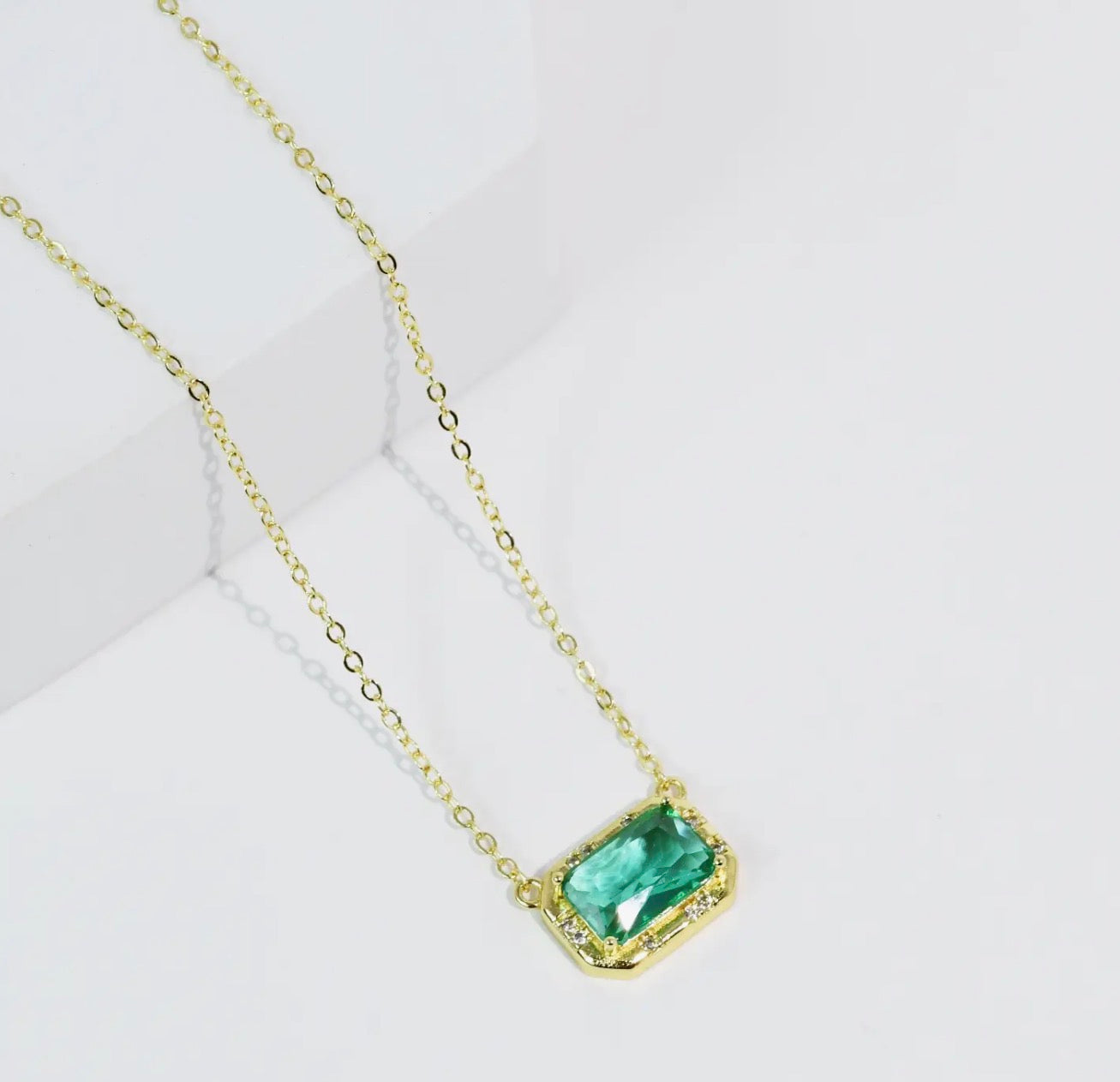 Close-up of Treasure Jewels Pretty Gem Necklace featuring colorful gemstone pendant on a delicate chain.