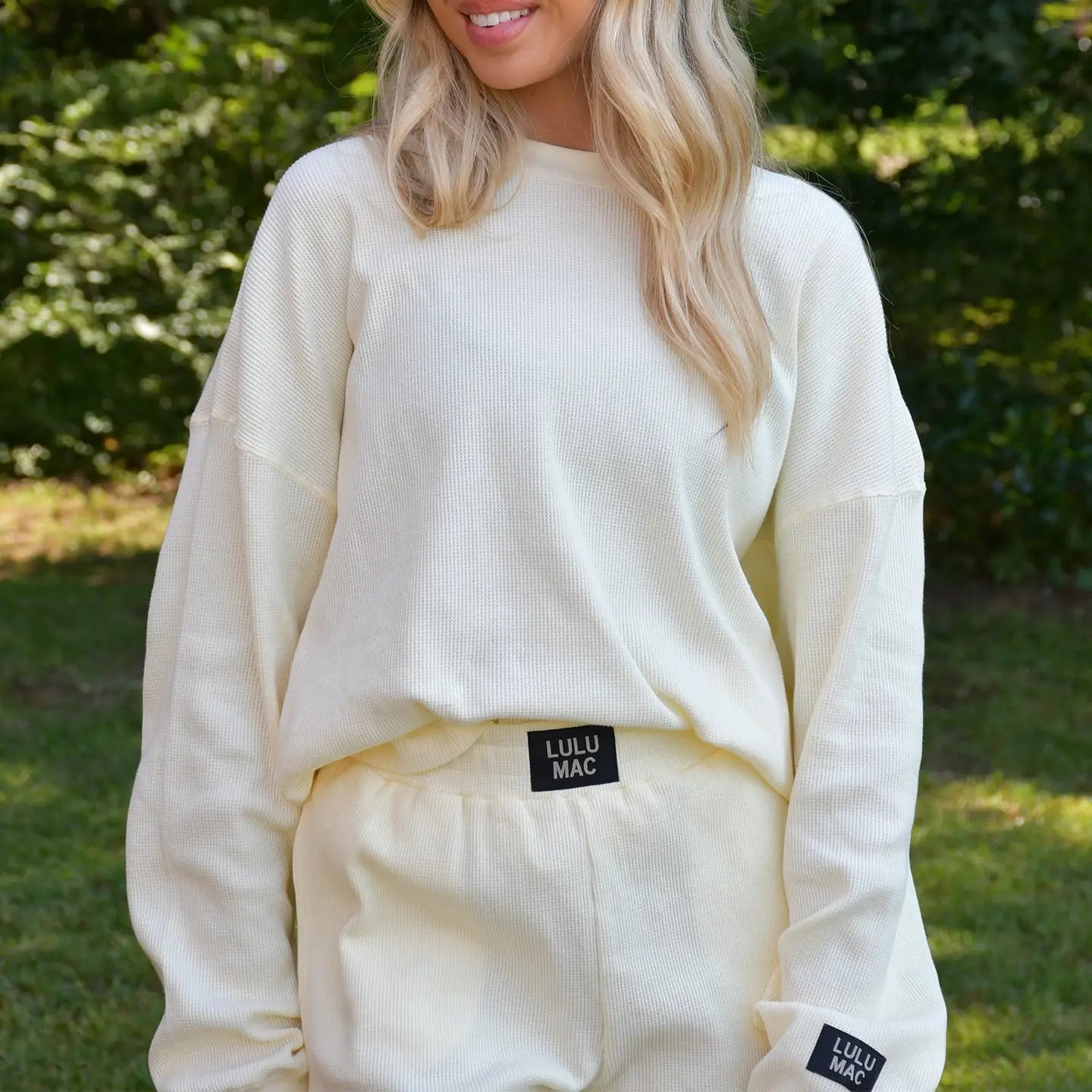 Lulu Mac Buttercup Breeze waffle knit top in soft yellow with long sleeves and a relaxed fit, casual and cozy for everyday wear.