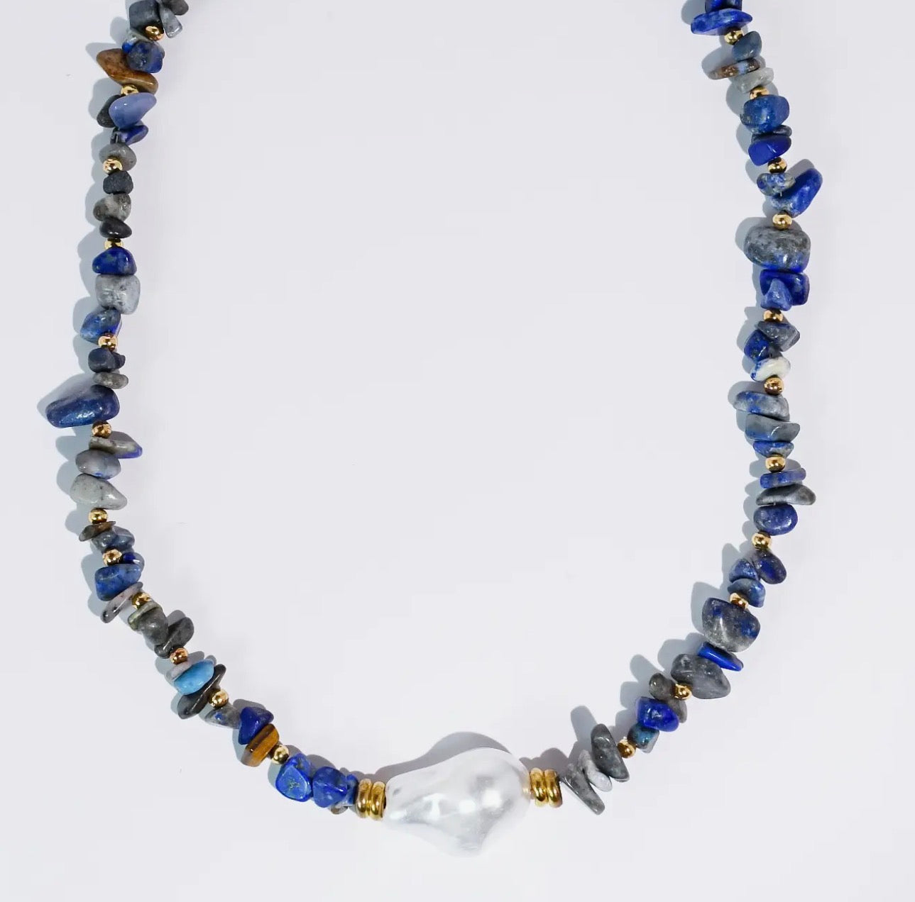 Enchanted Pearl Gemstone Necklace by Treasure Jewels featuring a string of lustrous pearls and sparkling gemstones.