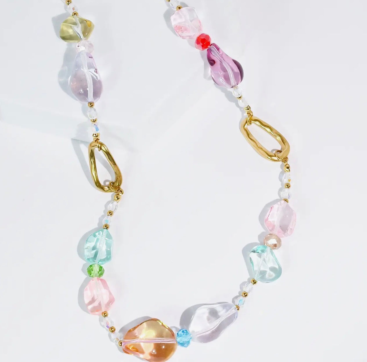 Pastel Pebbles Necklace by Treasure Jewels featuring colorful, smooth stone beads on a delicate chain.