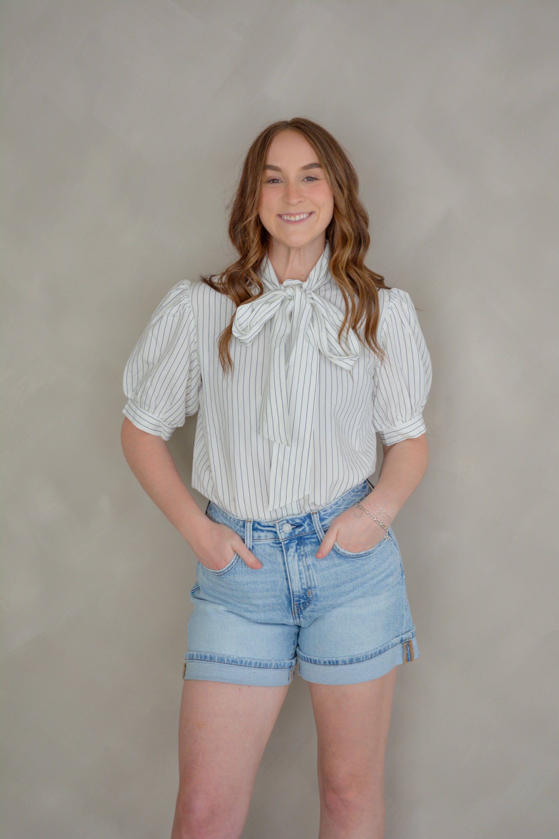 She+Sky The Sunday in Paris top featuring a stylish, flowy design with floral patterns and a relaxed fit, displayed on a hanger.
