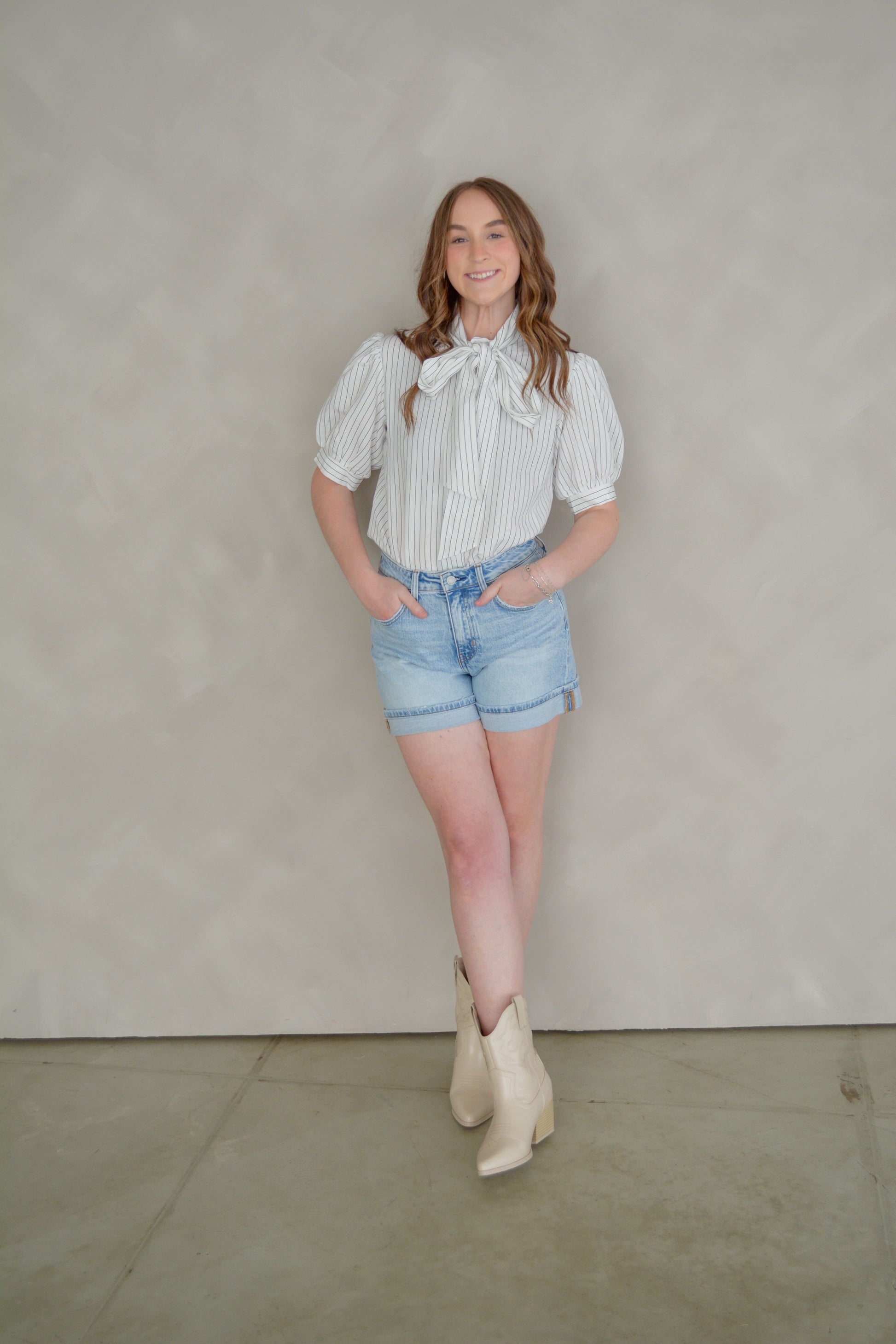 She+Sky The Sunday in Paris top displayed on a hanger, featuring a stylish, lightweight design with floral patterns.