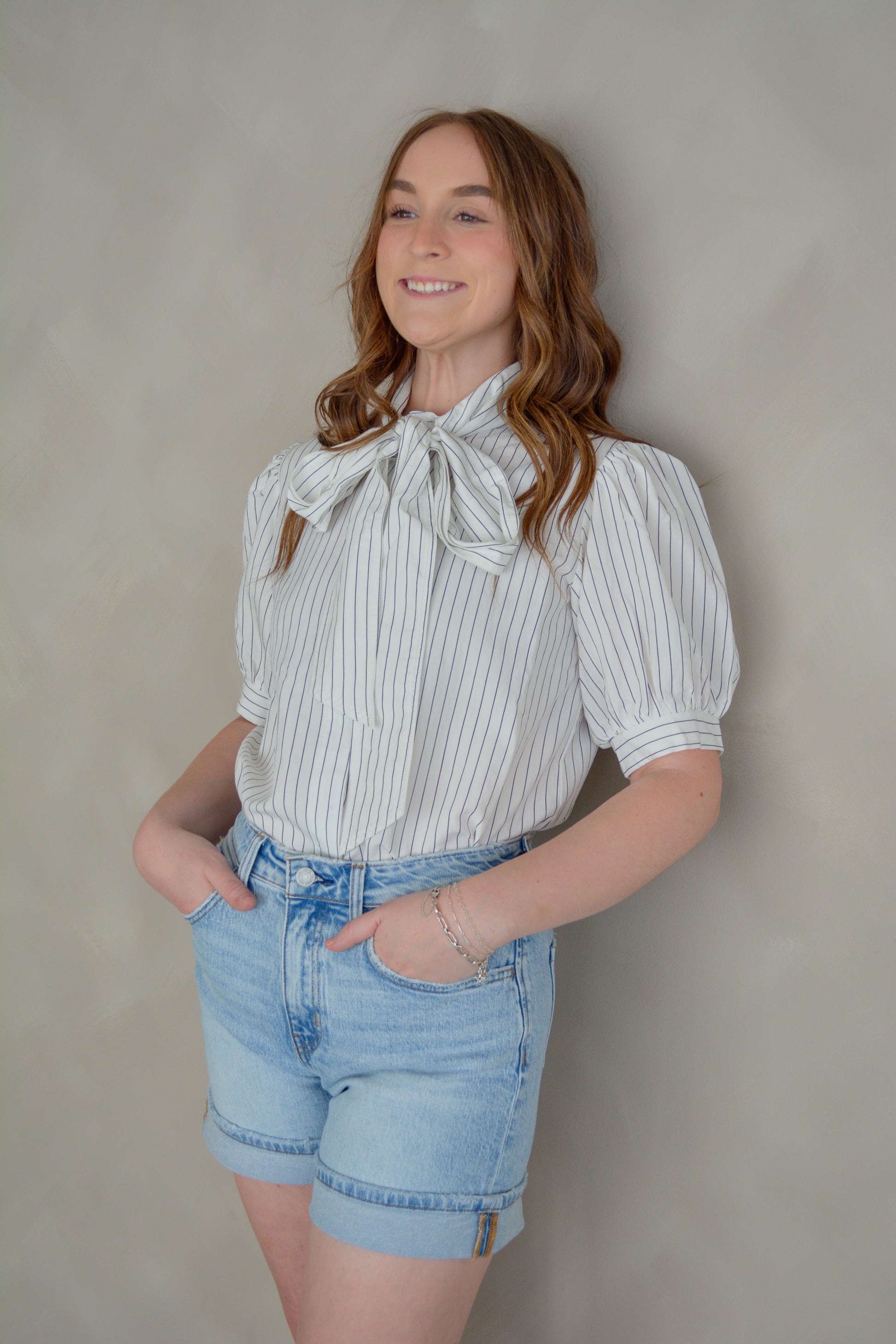 She+Sky The Sunday in Paris top displayed on a hanger, featuring a stylish, lightweight blouse with a relaxed fit and floral pattern.