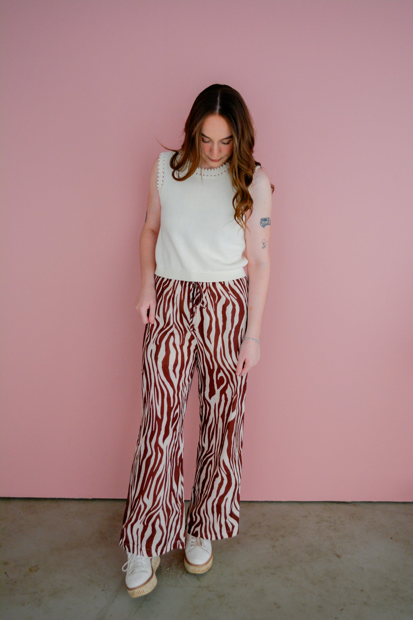 Entro Safari Chic pants displayed on a hanger, featuring a relaxed fit and earthy tones, perfect for casual and outdoor wear.