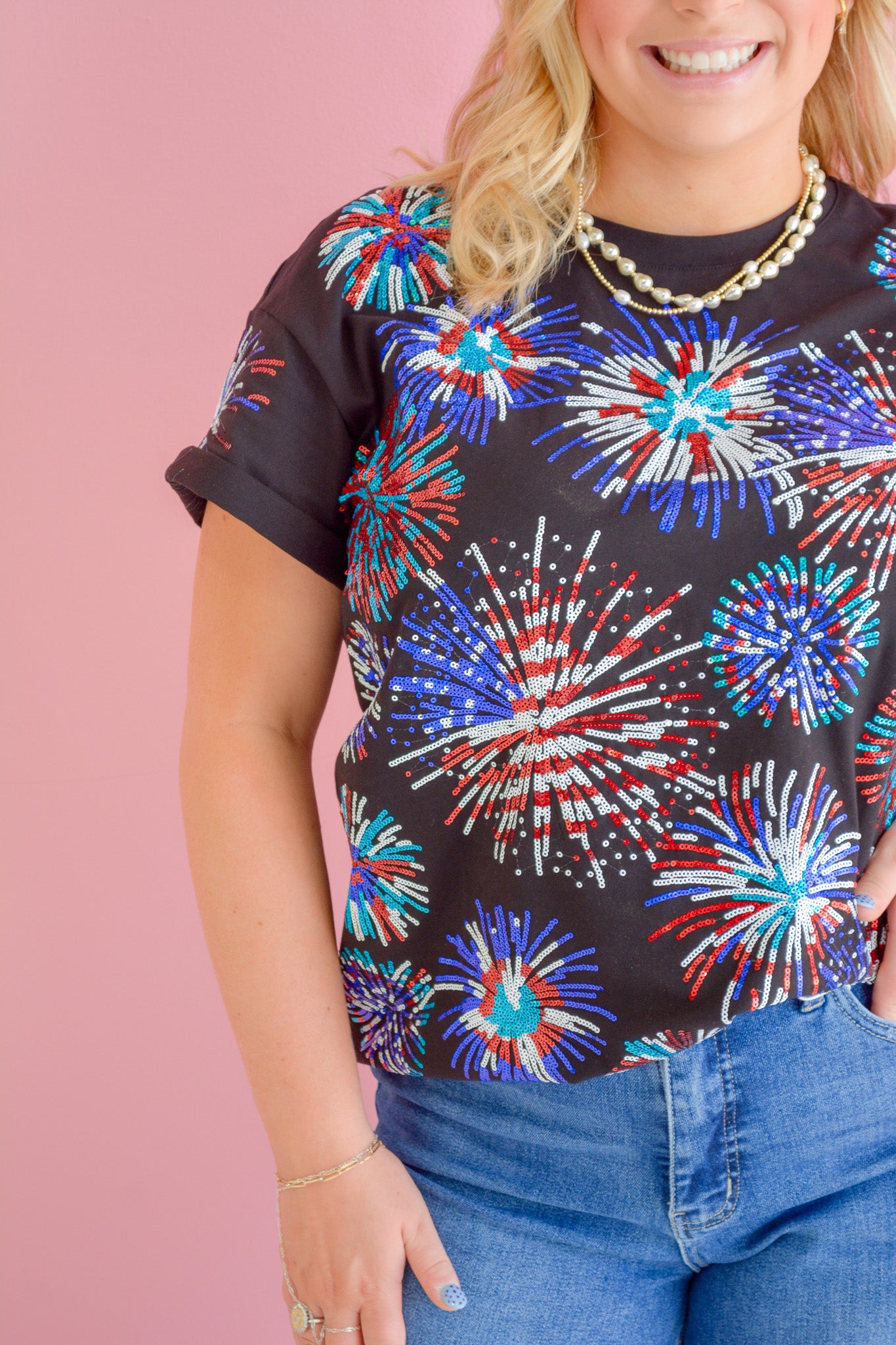 Rjm Glitz Midnight Firecracker T-shirt featuring a dark fabric with vibrant firecracker graphic design.