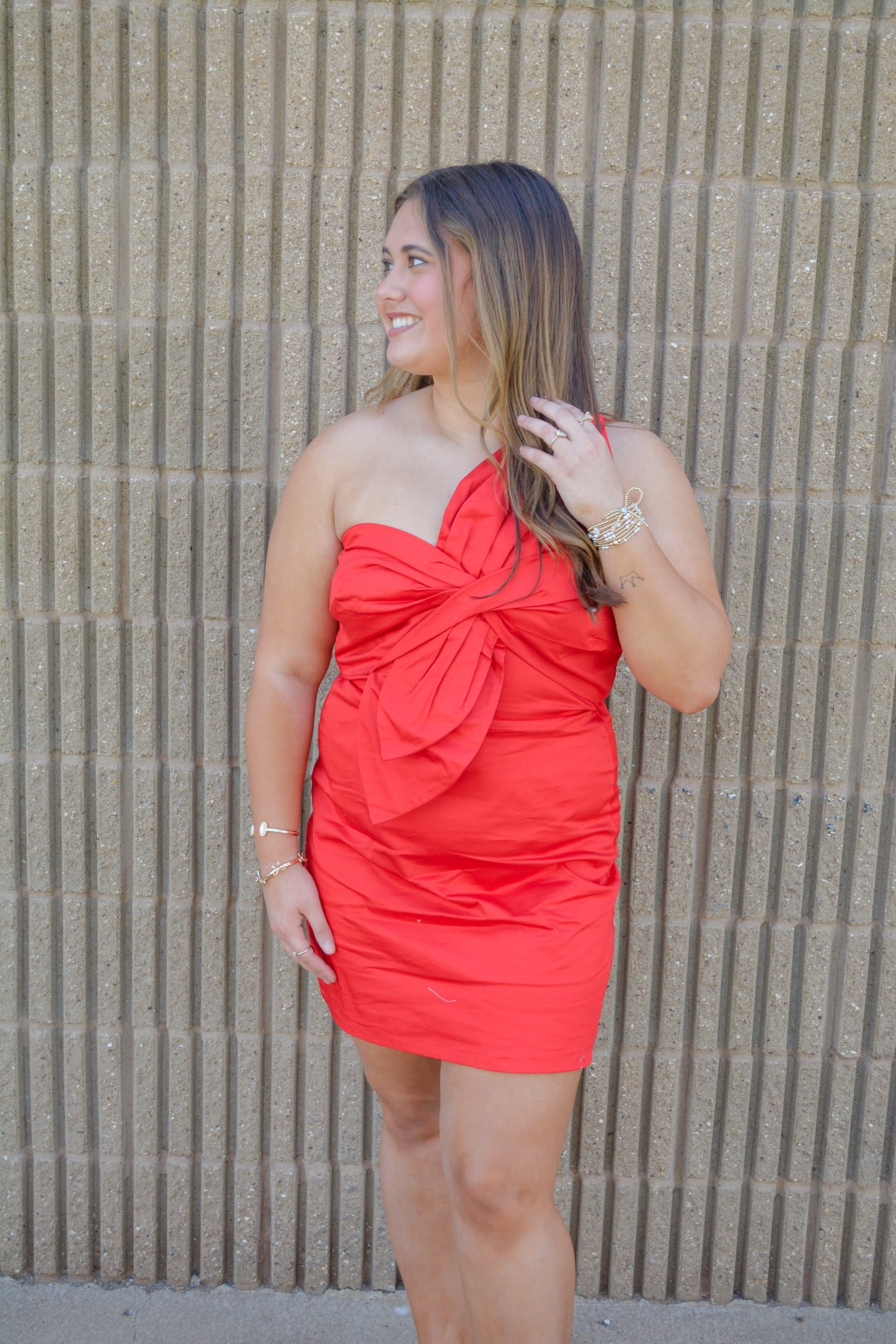 Strut & Bolt Confetti Moment Dress displayed on a hanger, featuring colorful confetti pattern and flowing fabric.