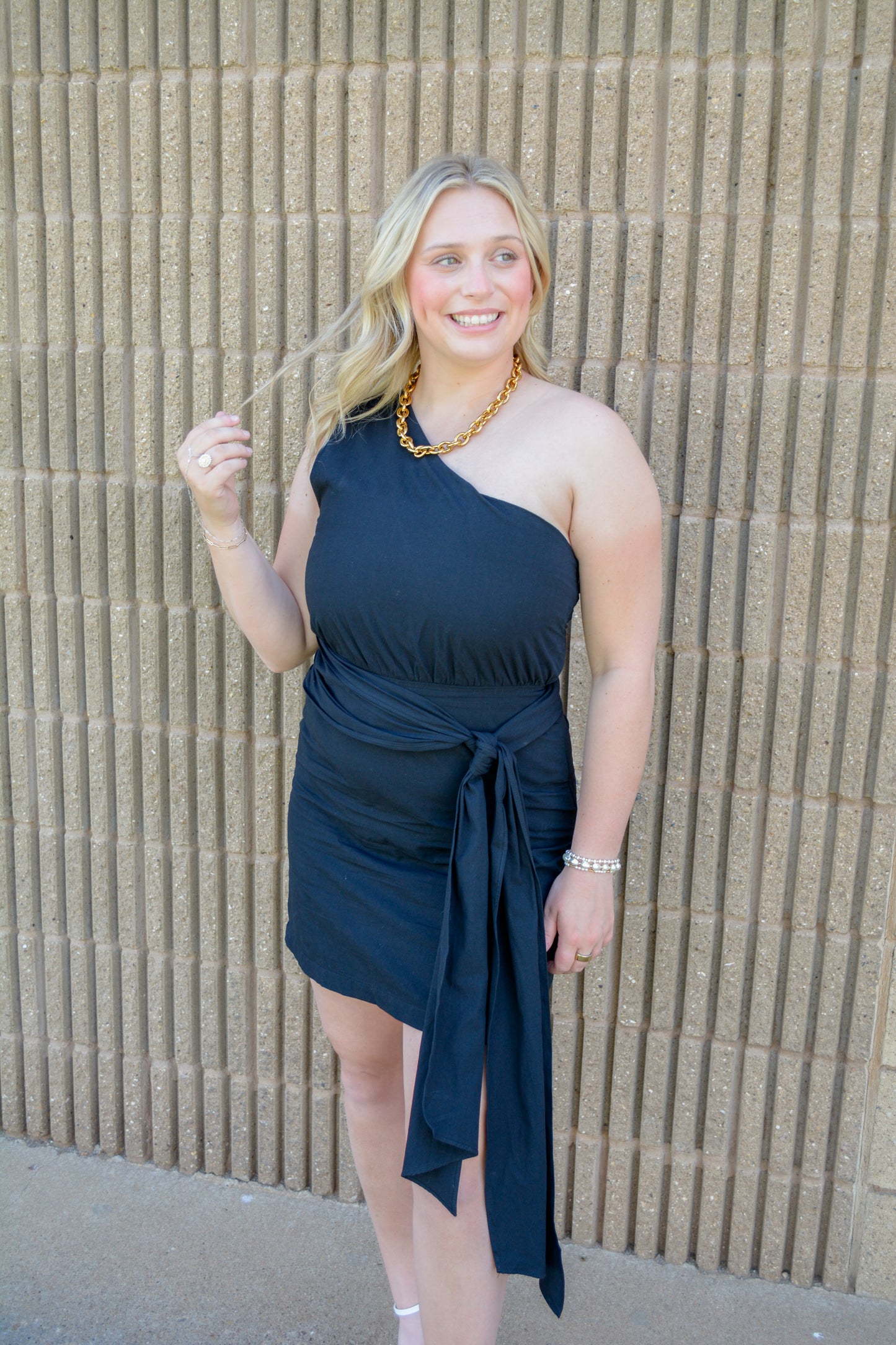 TCEC Bows and Confetti Wrap Dress showing colorful fabric with bow details and a flattering wrap silhouette.