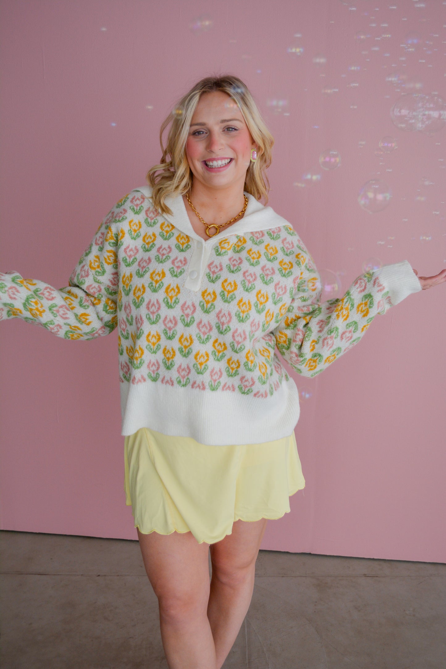 So Me Flora Voyage sweater featuring a floral pattern, cozy knit, and vibrant colors, displayed on a mannequin.
