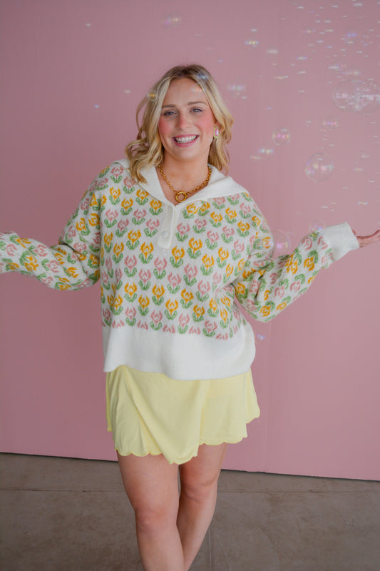 So Me Flora Voyage sweater featuring a floral pattern, cozy knit, and vibrant colors, displayed on a mannequin.