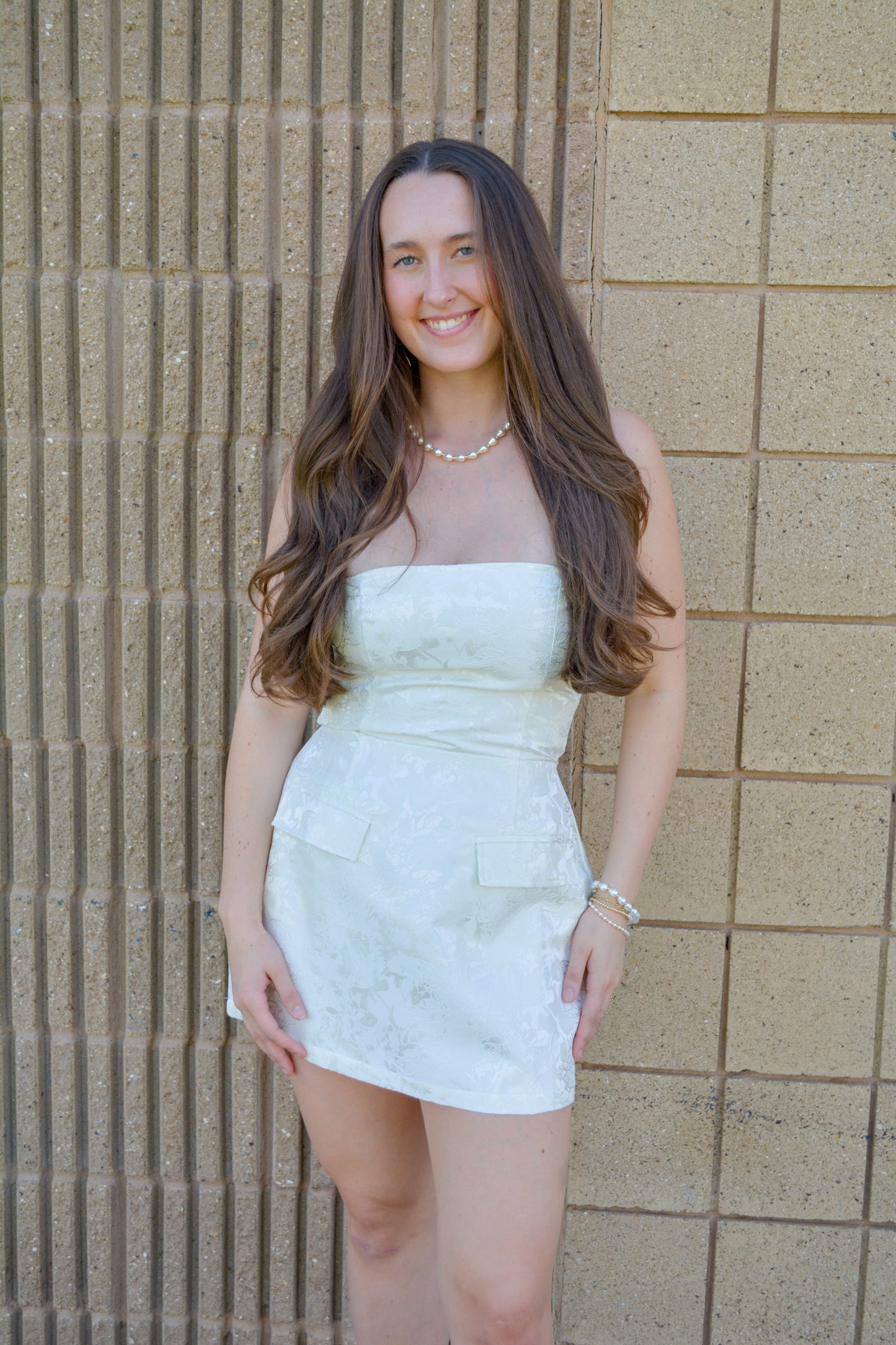 Evenuel Skyline Jacquard Mini Dress displayed on a hanger, featuring intricate pattern and stylish design.