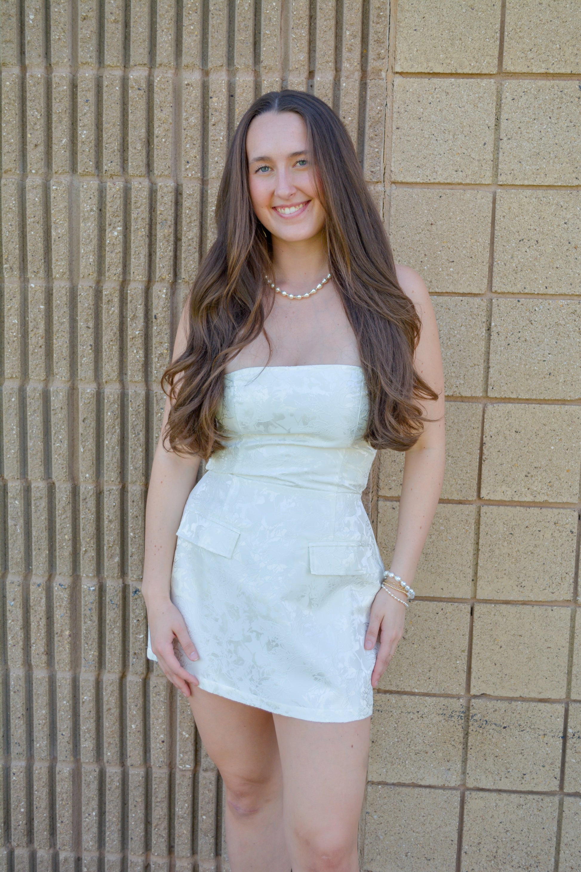 Evenuel Skyline Jacquard Mini Dress displayed on a hanger, featuring intricate pattern and stylish design.