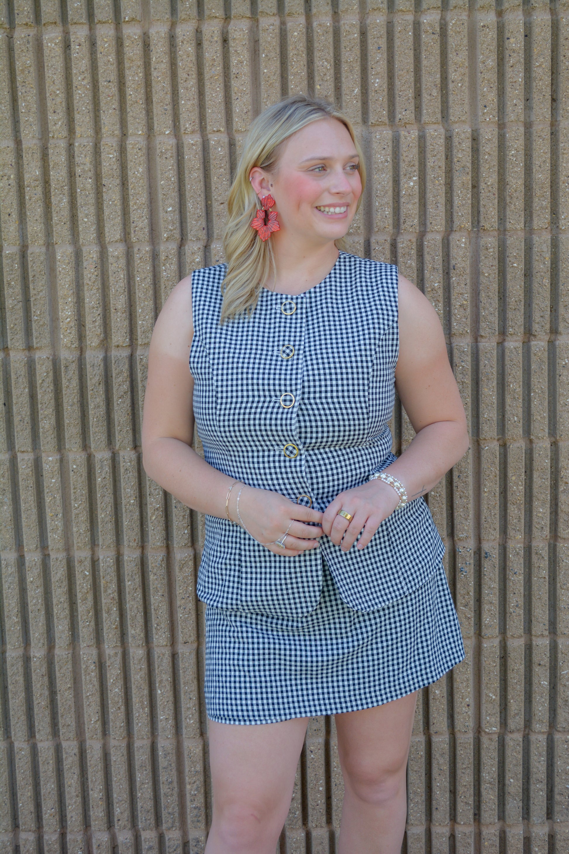 Entro Sweet Celebration gingham romper for girls, featuring a cute sleeveless design with bow accents and adjustable straps.