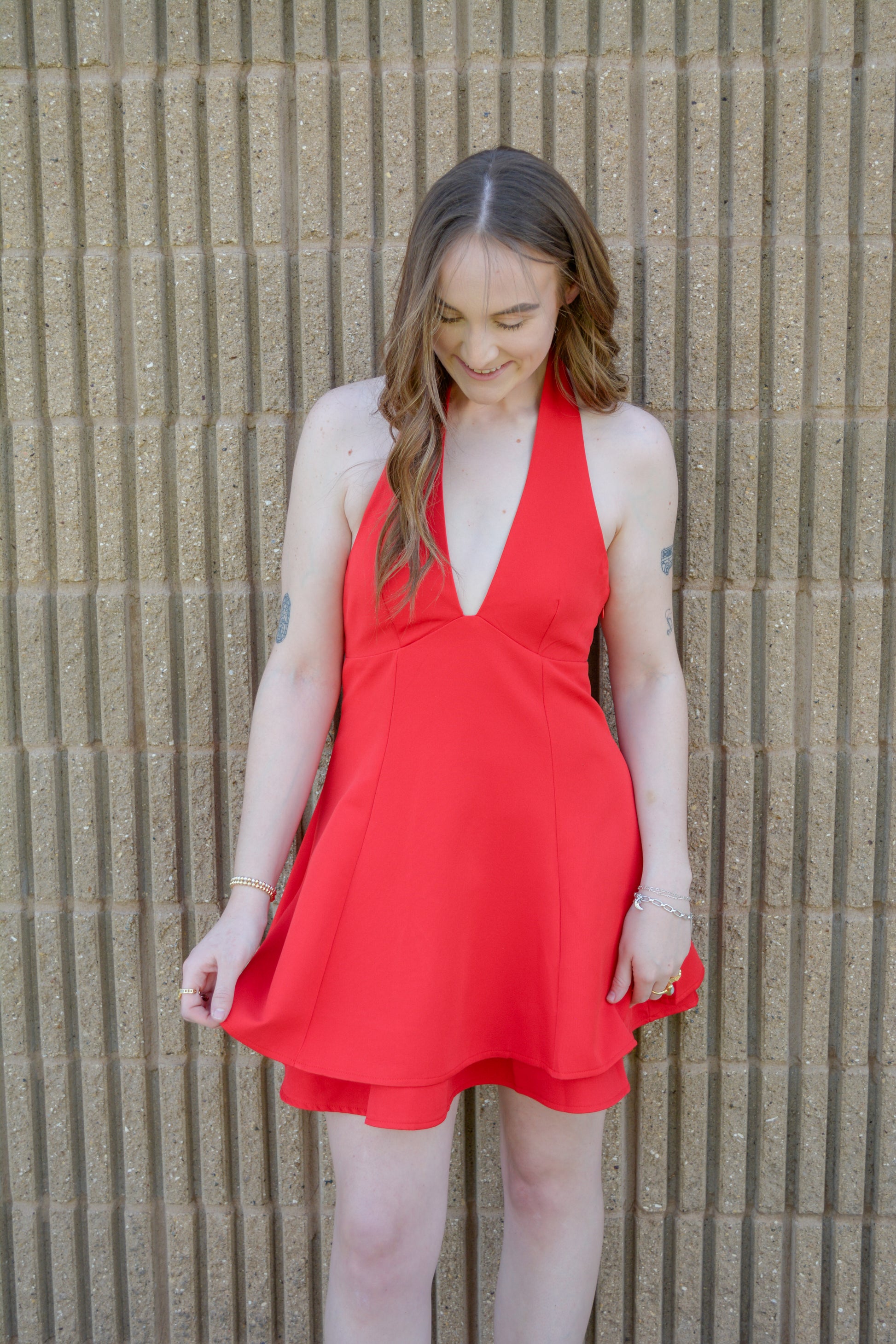 TCEC fit and flare mini dress displayed on a hanger, featuring a stylish, sleeveless design with a fitted bodice and flared skirt.
