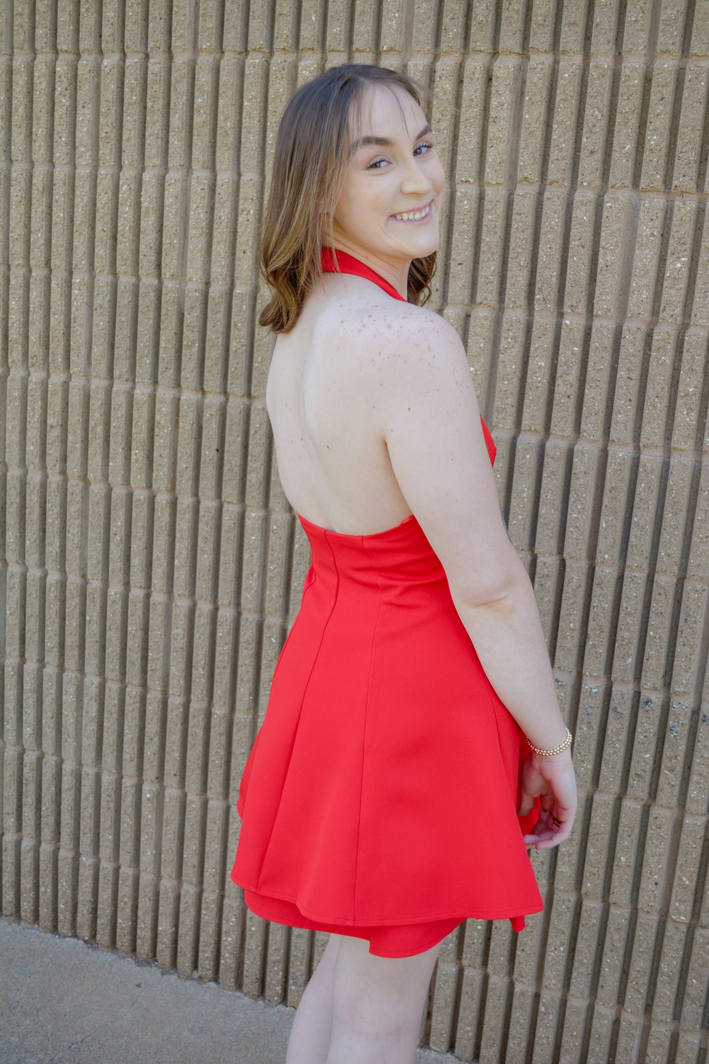 TCEC fit and flare mini dress displayed on a hanger, showcasing its stylish silhouette and vibrant fabric.