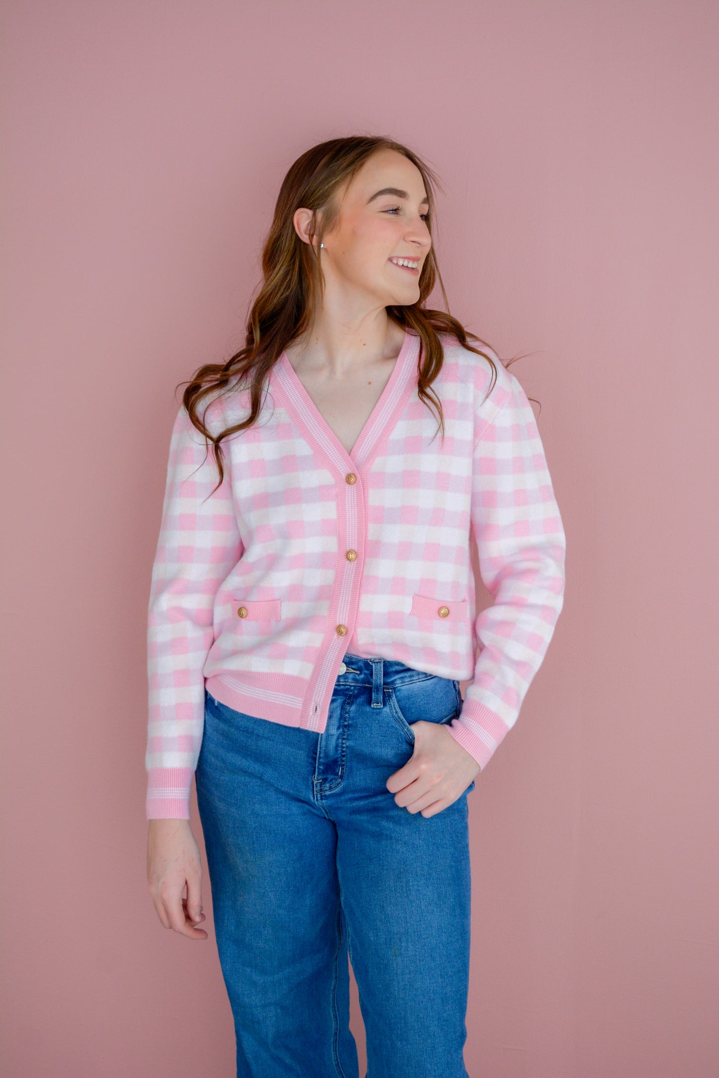 Pink gingham cardigan by Brianna Cannon, featuring a soft knit fabric and classic button-front design.