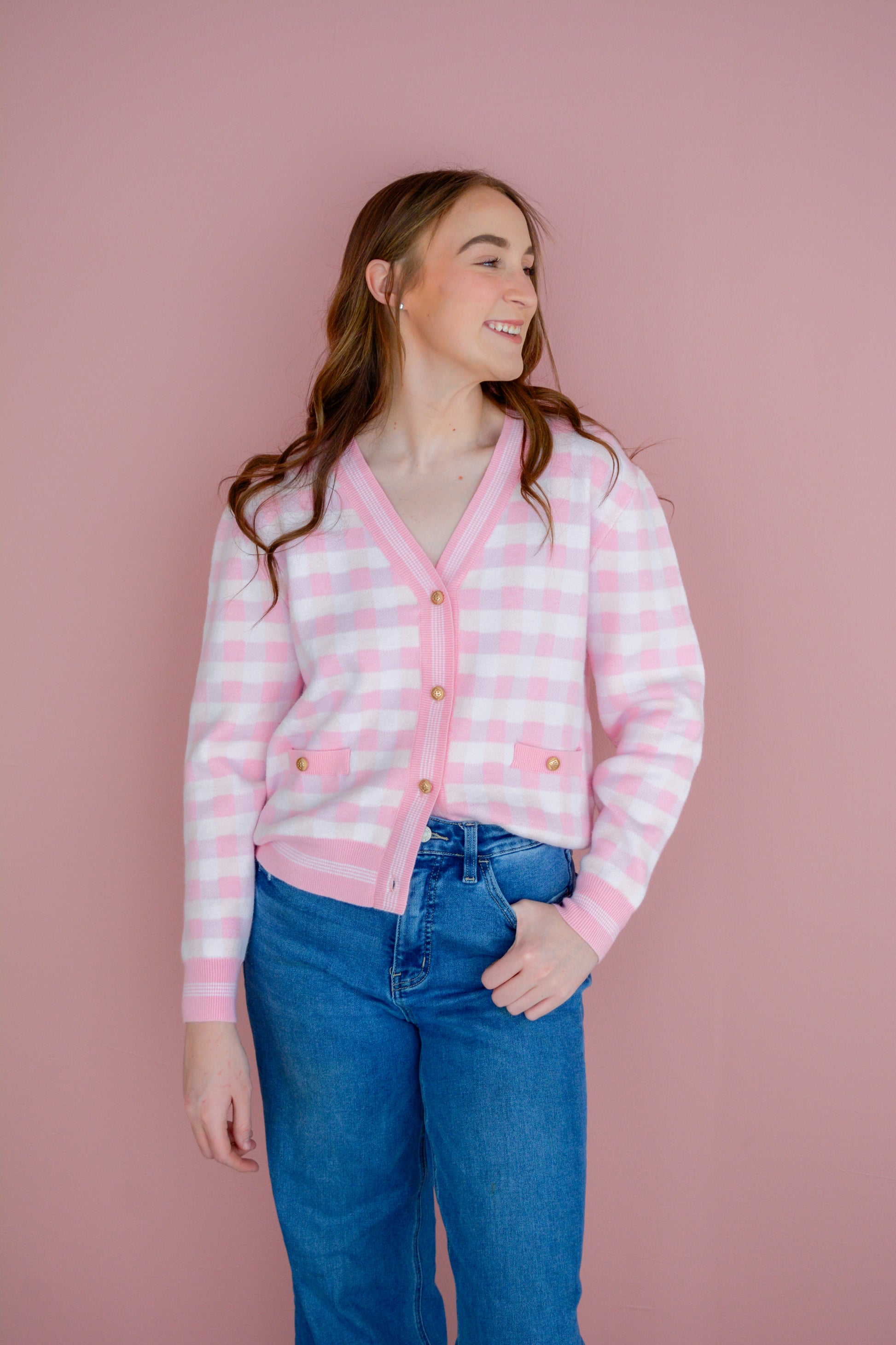 Pink gingham cardigan by Brianna Cannon, featuring a soft knit fabric and classic button-front design.