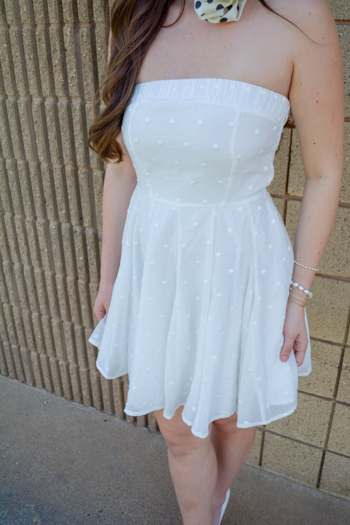 Mable Spring Fling Dress displayed on a hanger with floral pattern and pastel colors, perfect for spring occasions.