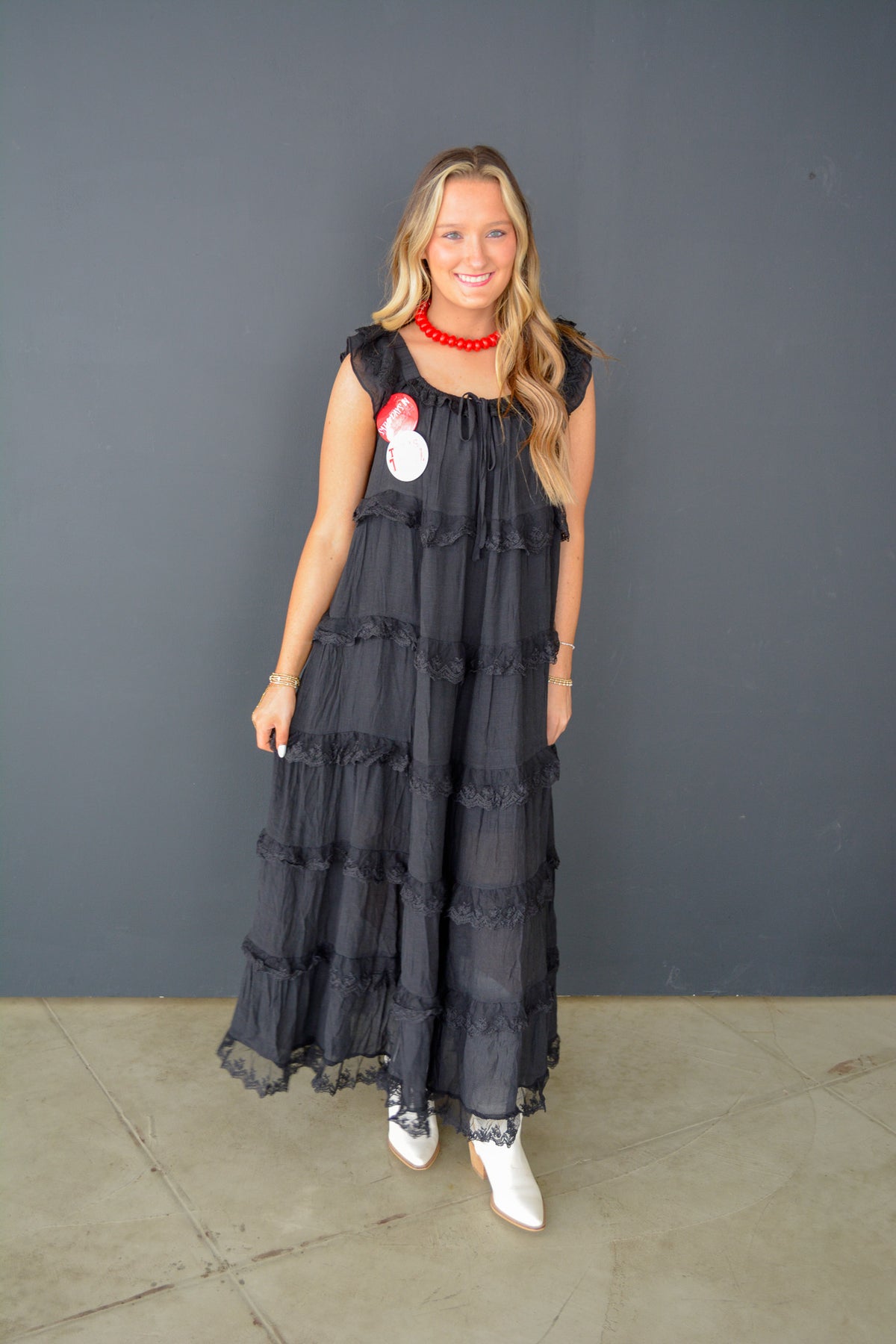 &Merci Moonlit Grace Midi Dress displayed on a hanger, featuring flowing fabric and elegant design in soft moonlit color.