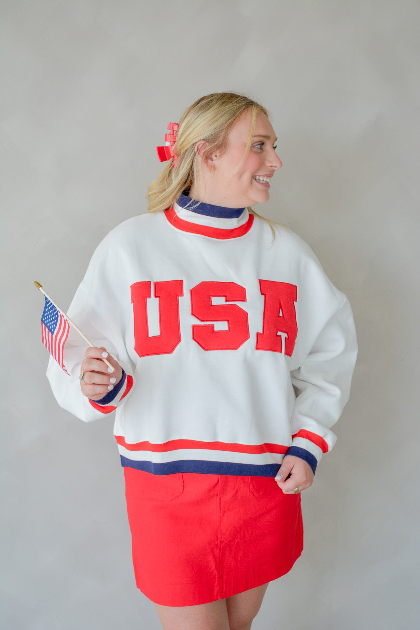 TCEC The All-American Pullover in red and white, featuring a classic design with a crew neck and ribbed cuffs.