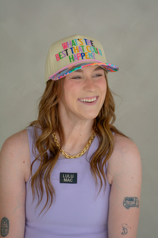 Poppy & Pine “What’s The Best That Could Happen” hat featuring a casual, stylish design with embroidered text on soft fabric.