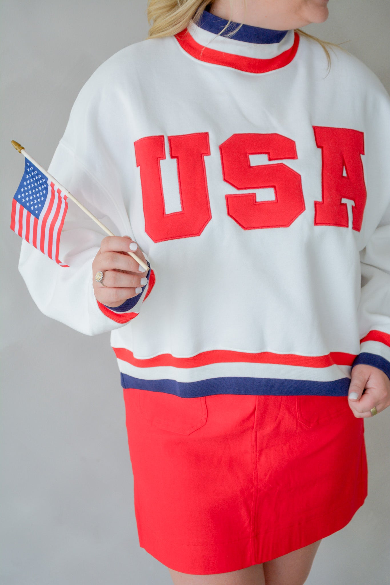 TCEC The All-American Pullover in red with white star design, showing front view of cozy fleece fabric.