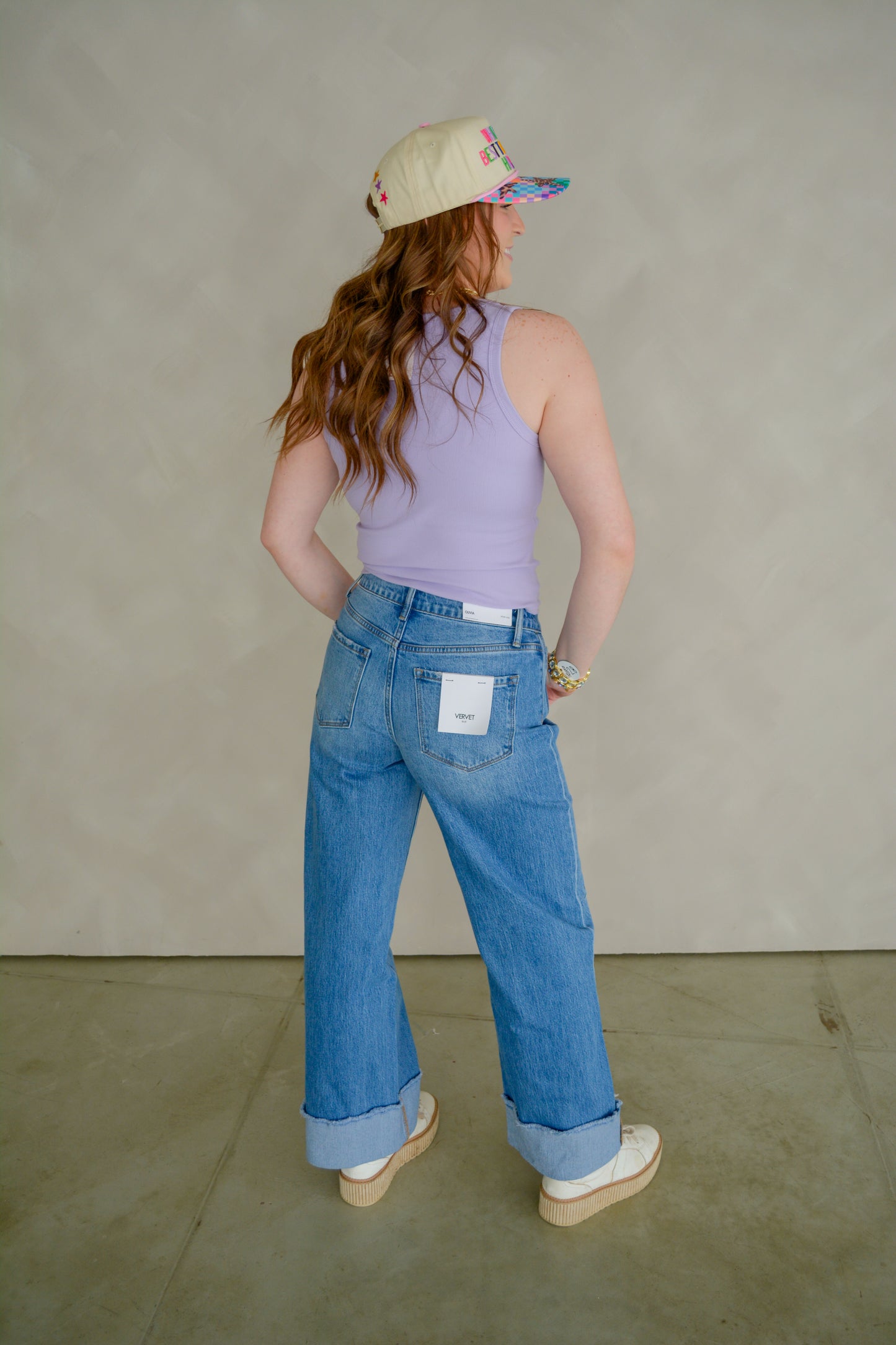 Vervet Downtown Darling denim jeans displayed on a hanger, featuring classic blue wash and slim fit style.