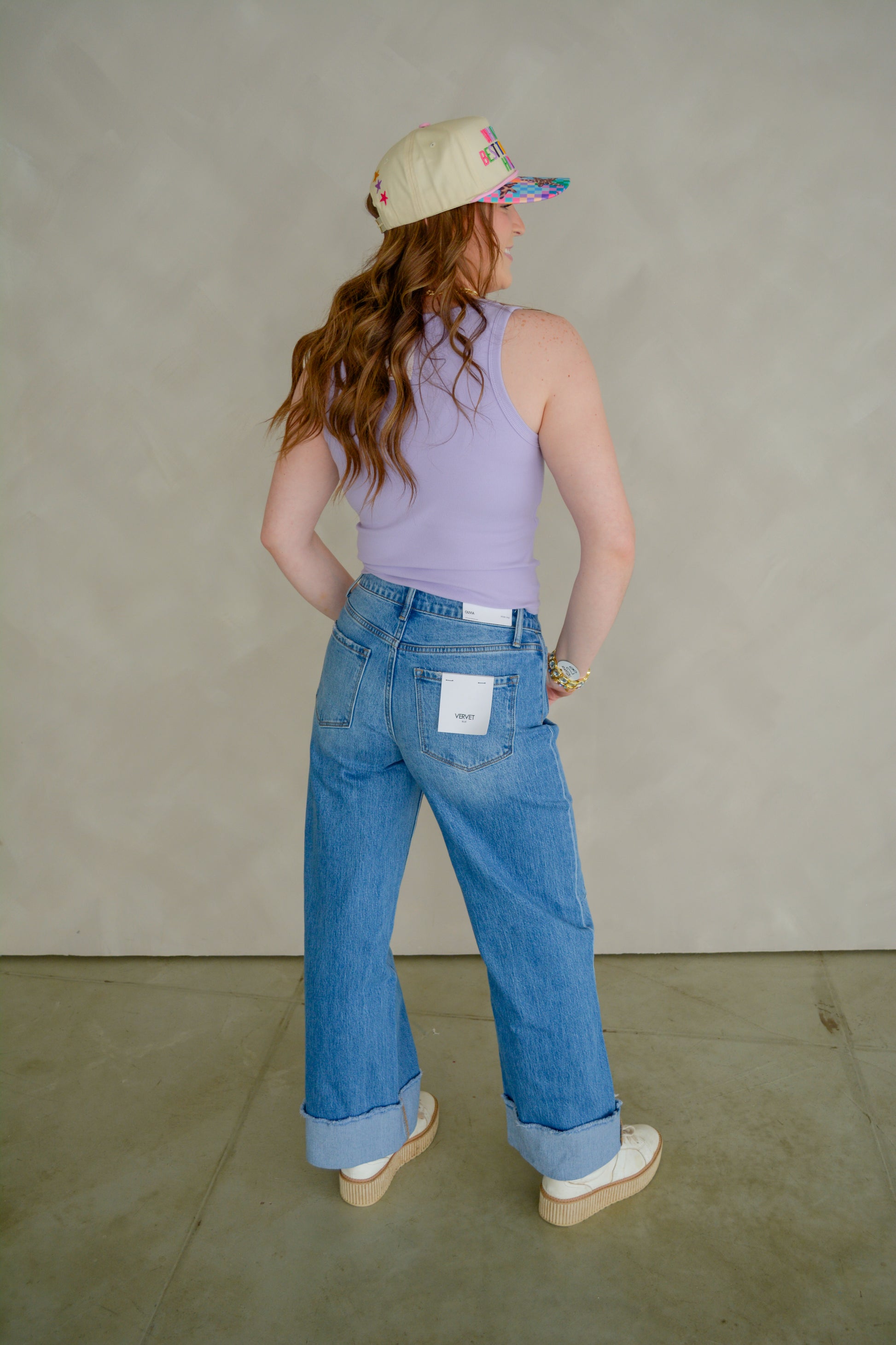 Vervet Downtown Darling denim jeans displayed on a hanger, featuring classic blue wash and slim fit style.