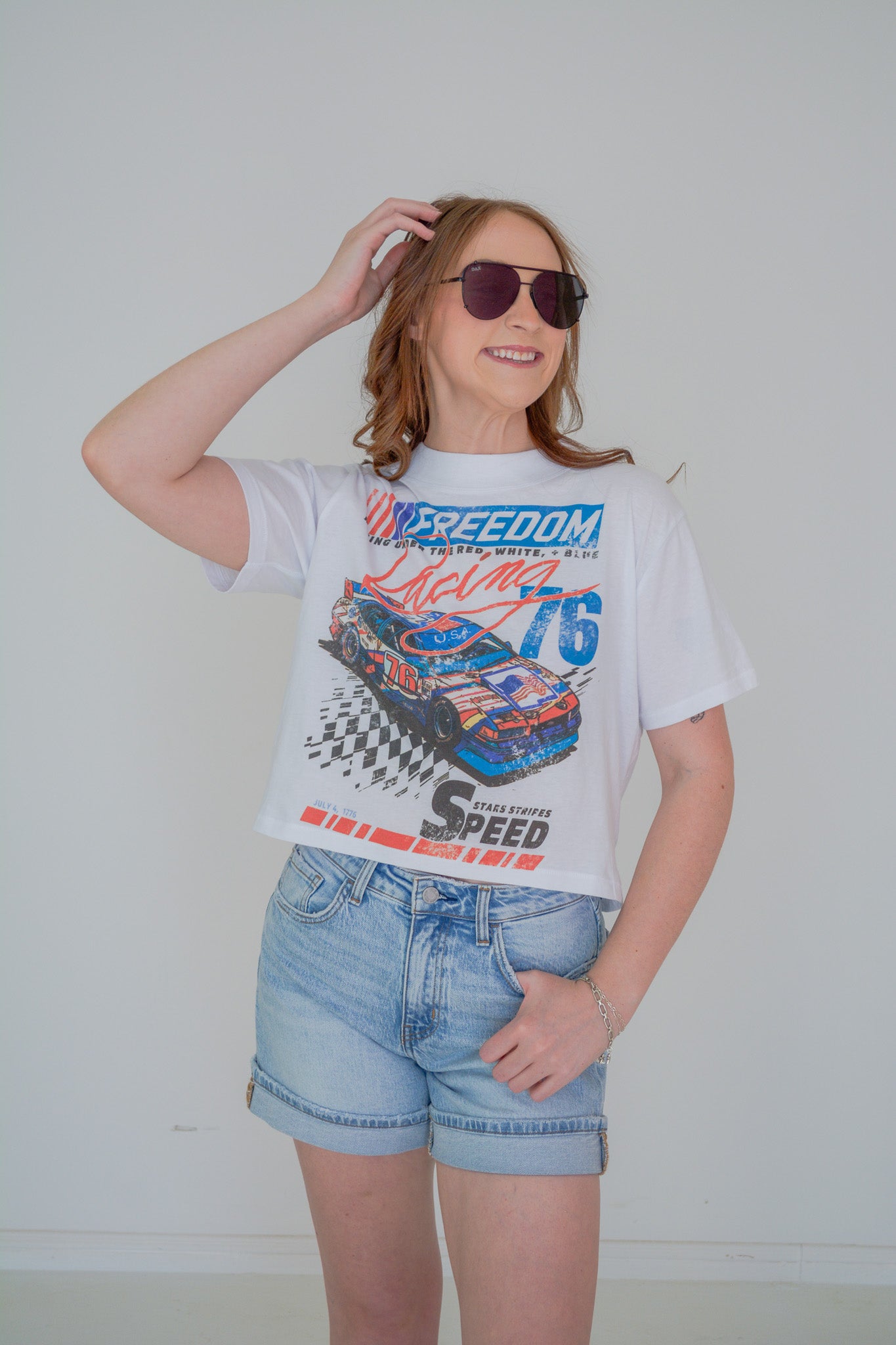 Chaudoin Creations Stars Stripes & Speed cropped T-shirt featuring bold star and stripe pattern on lightweight fabric.