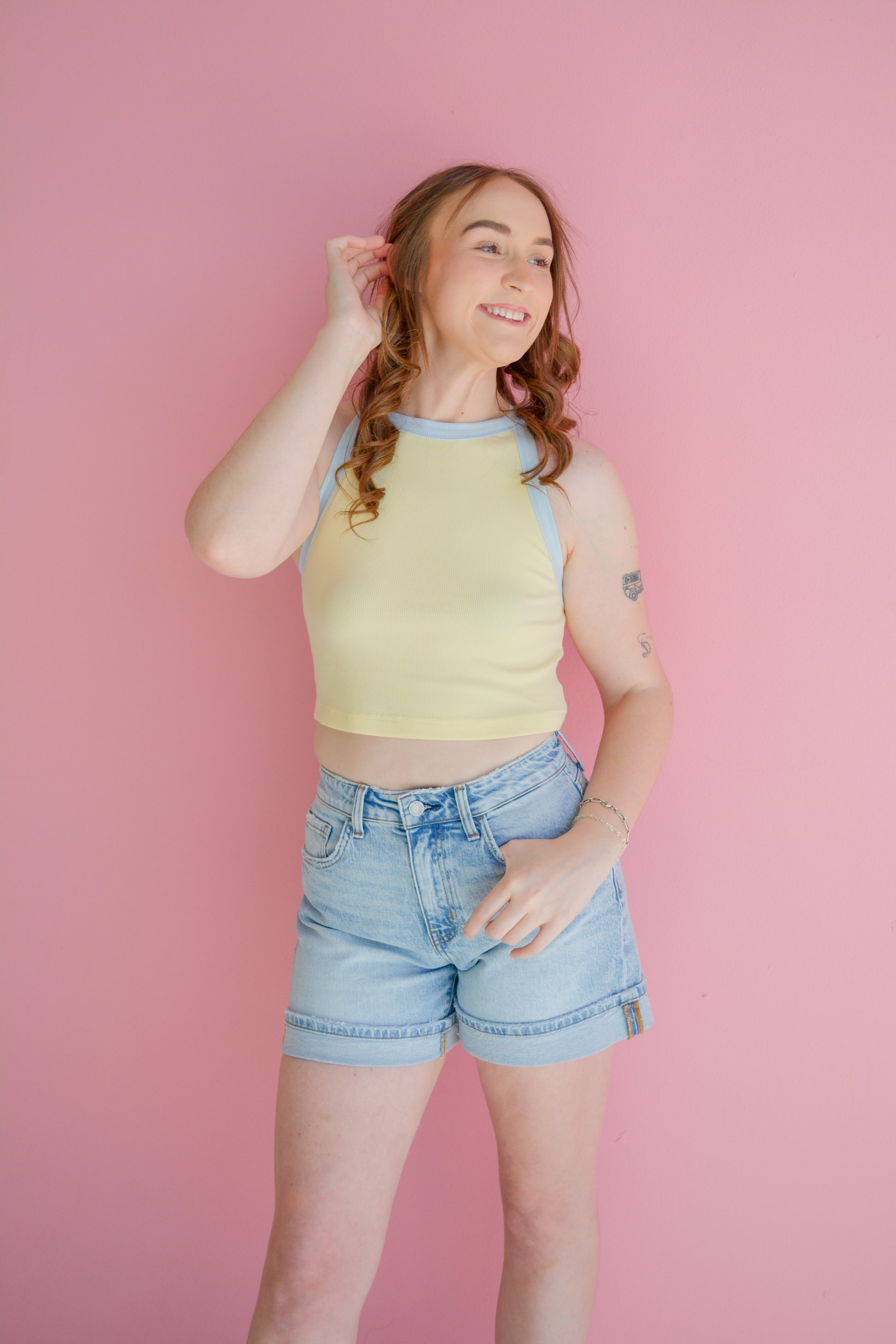 Vervet The Weekend Cuffed Shorts in denim, showing a close-up of the cuffed hem and distressed details on the fabric.