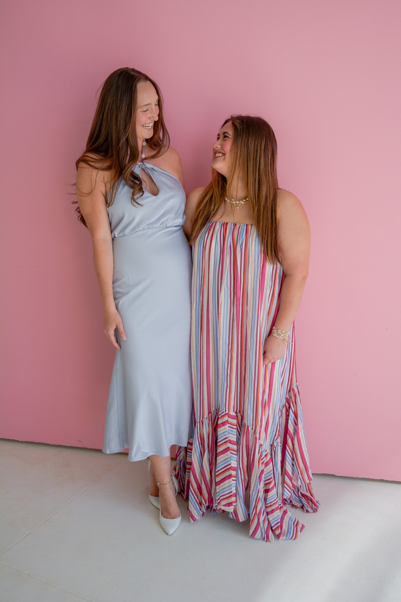 TCEC Summer Skies maxi dress with floral pattern, flowing fabric, and sleeveless design, displayed on hanger against a white background.