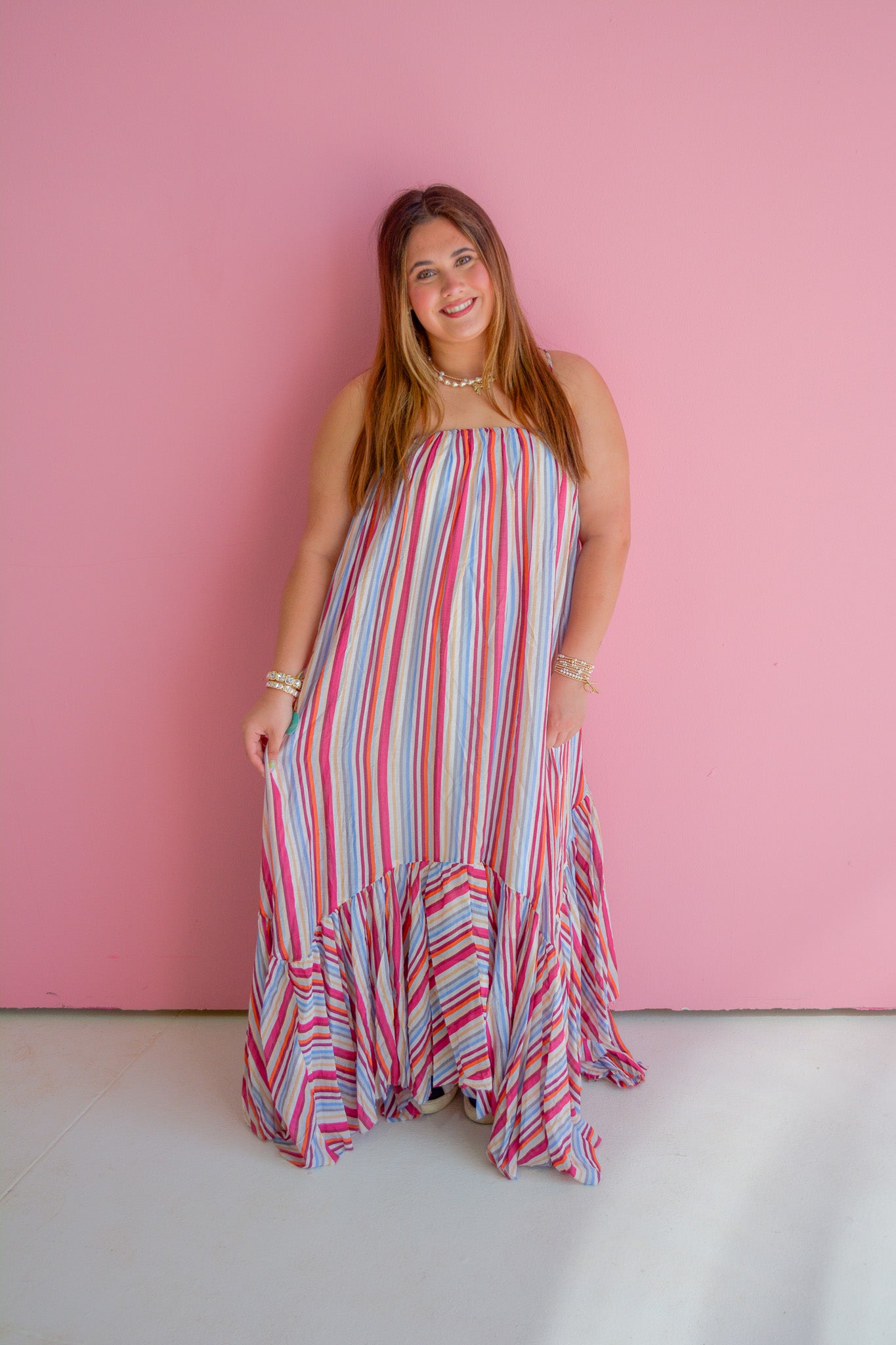 TCEC Summer Skies Maxi Dress featuring a flowy fabric and vibrant print, displayed on a hanger against a neutral background.