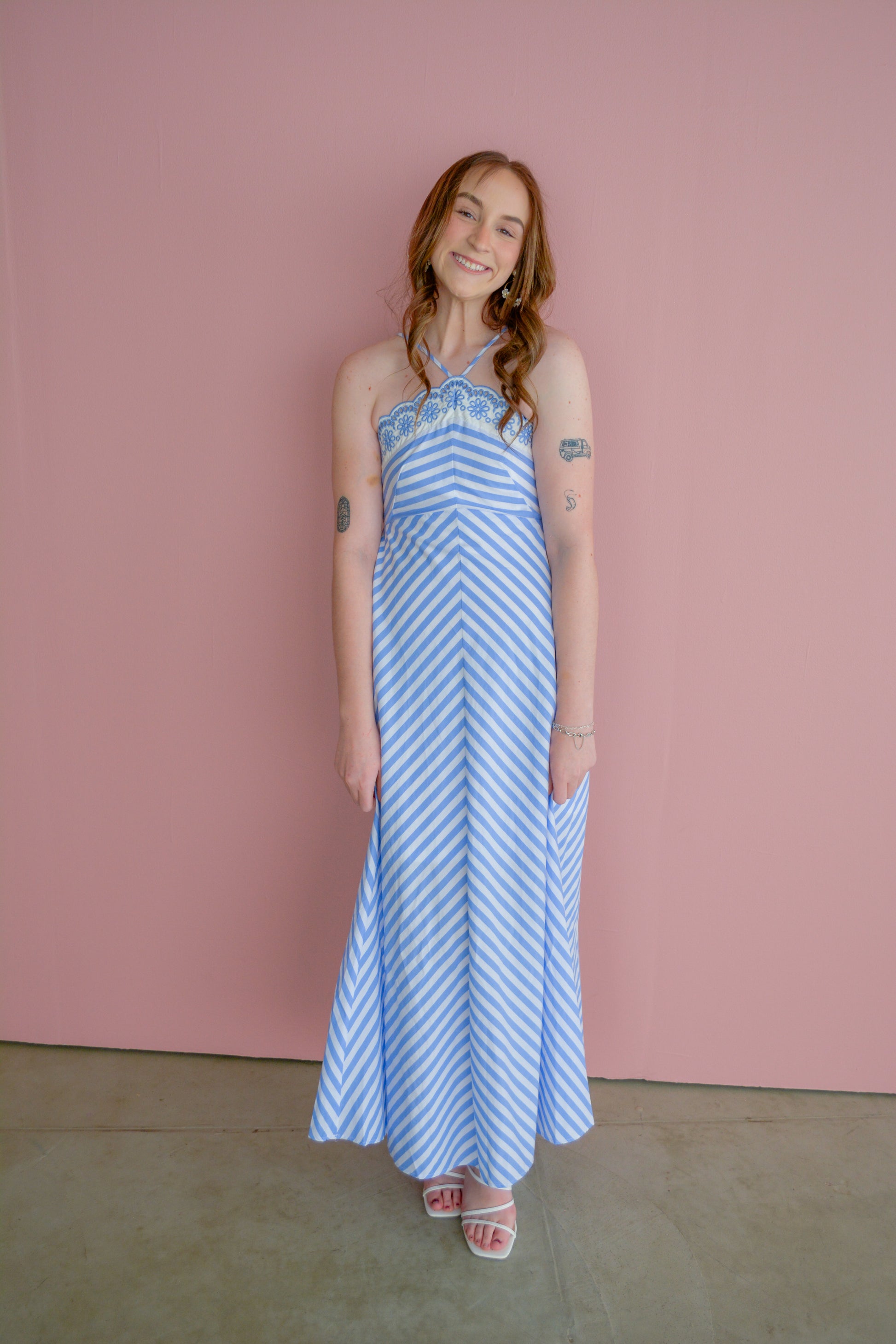 Entro Sunset Celebration Dress with flowing fabric, vibrant sunset-inspired colors, and elegant design.