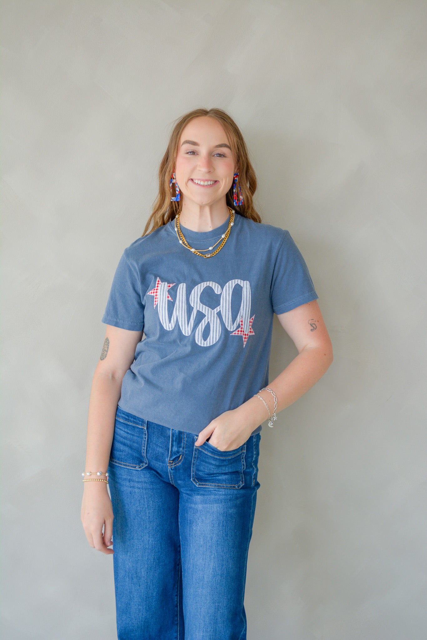 USA Comfort Tee from Shop Southern Belle featuring a casual fit and patriotic design, displayed on a hanger.