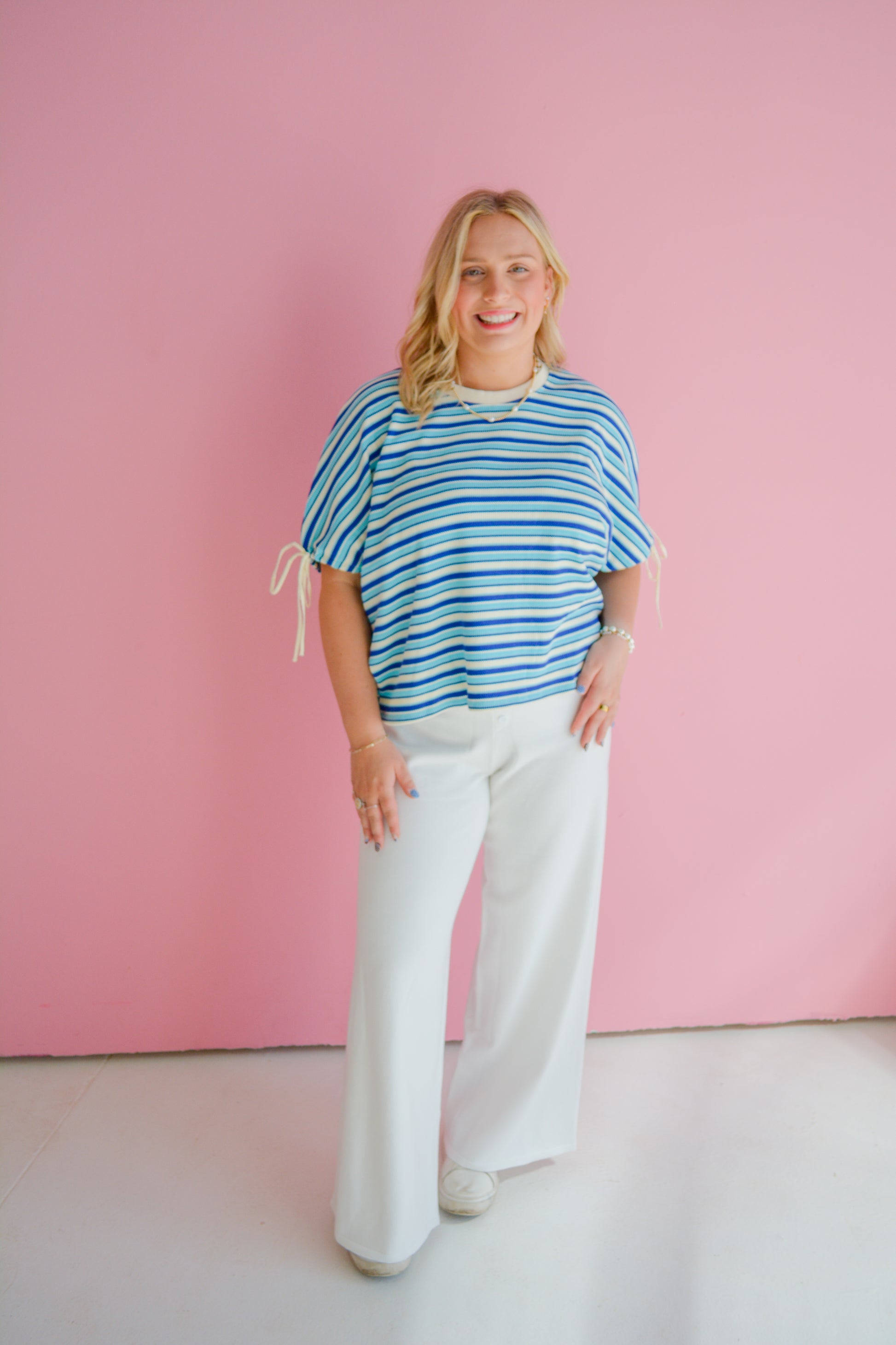 Entro Seaside Stripe Top with blue and white horizontal stripes, lightweight fabric, and relaxed fit.